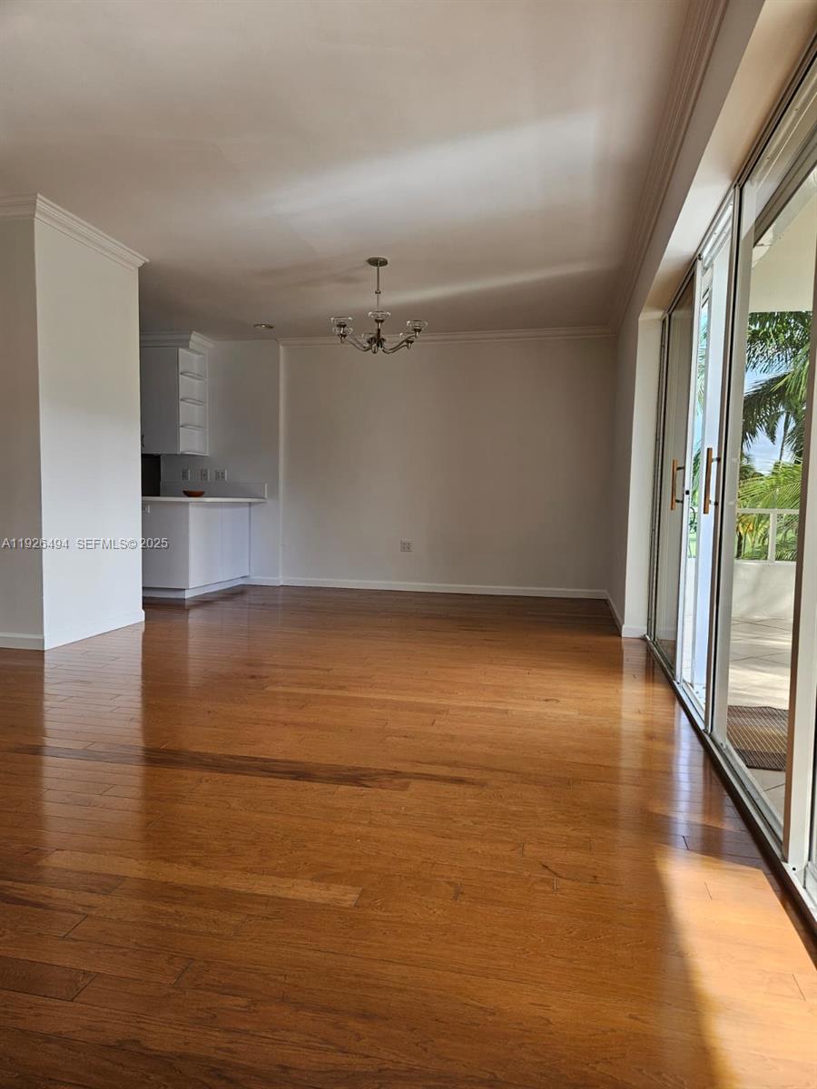 44 Cocoanut Row, Unit 306A Palm Beach, FL 33480 - Photo 7 of 11 wooden floor in an empty room with a window