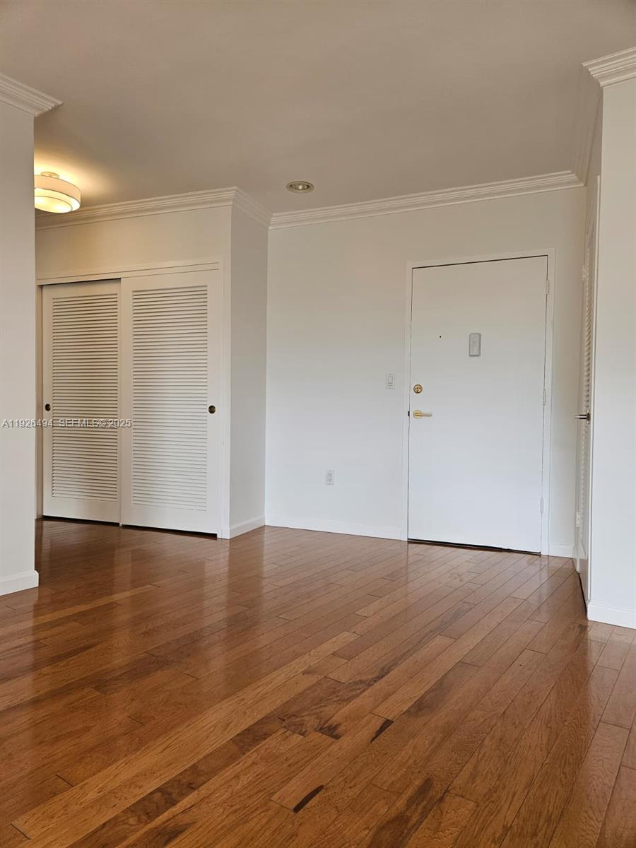 44 Cocoanut Row, Unit 306A Palm Beach, FL 33480 - Photo 8 of 11 a view of an empty room with wooden floor