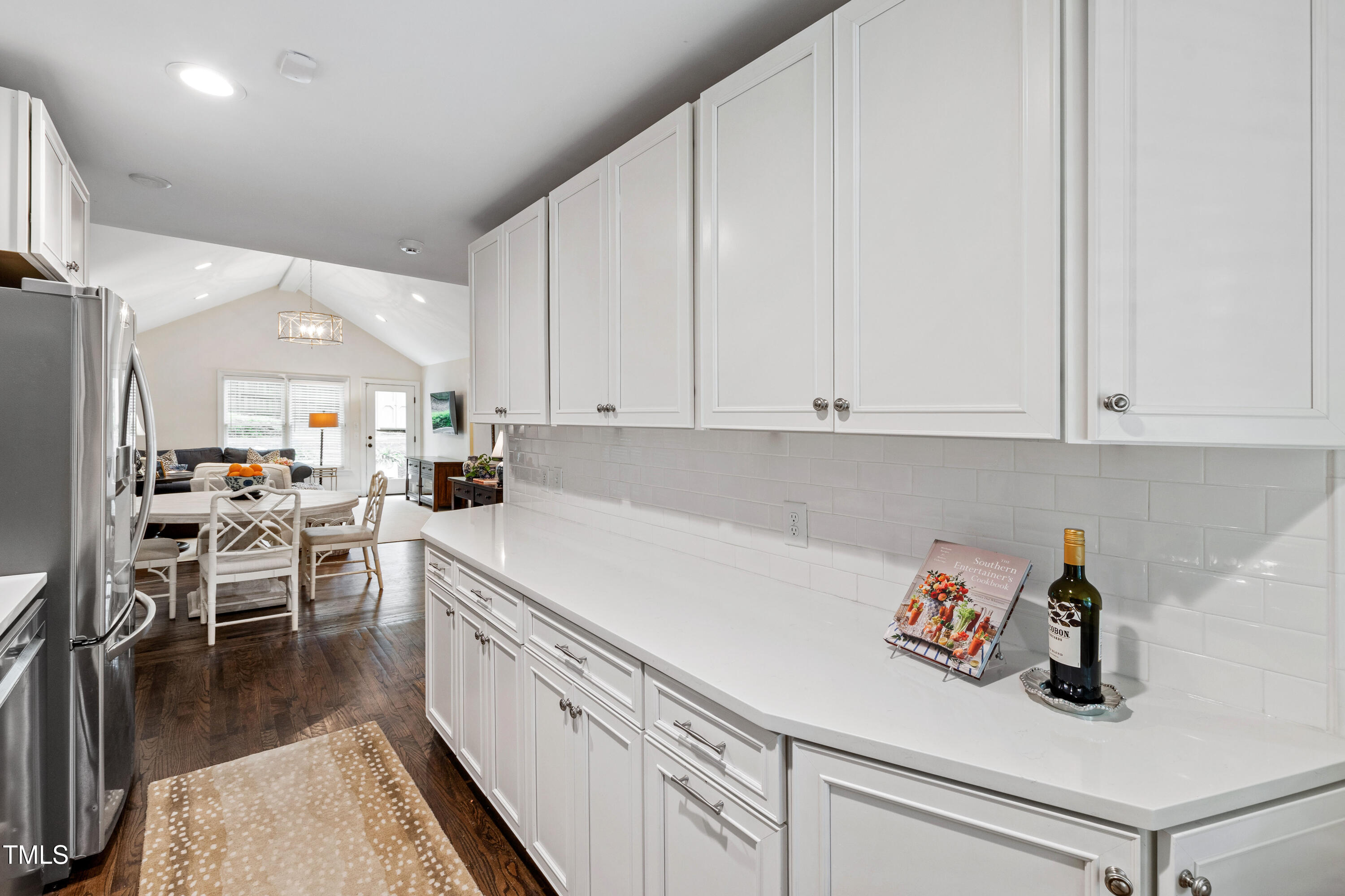 2415 Van Dyke Avenue Raleigh, NC 27607 - Photo 11 of 24 a kitchen with white cabinets and sink