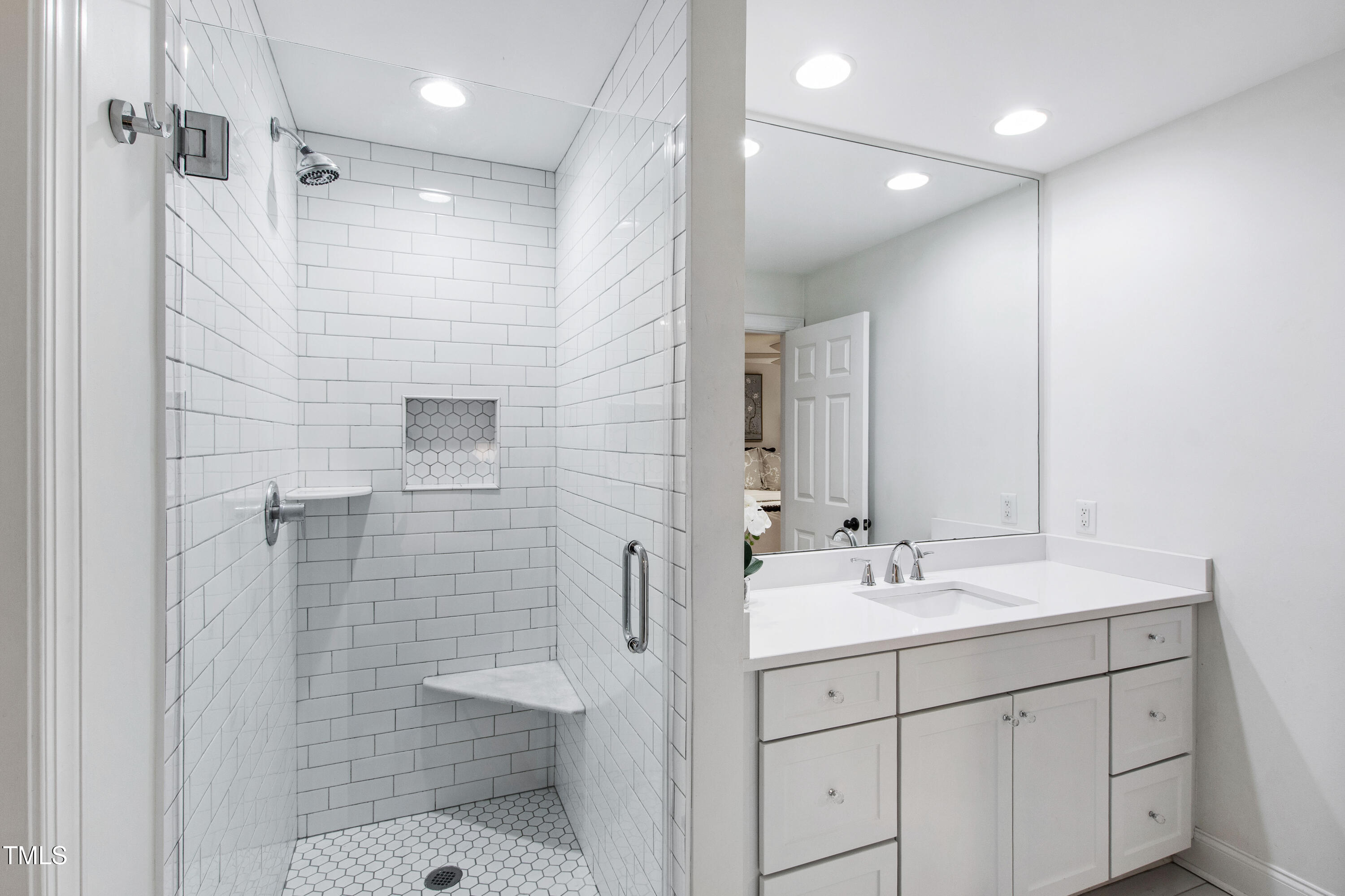 2415 Van Dyke Avenue Raleigh, NC 27607 - Photo 13 of 24 a bathroom with a shower sink and mirror