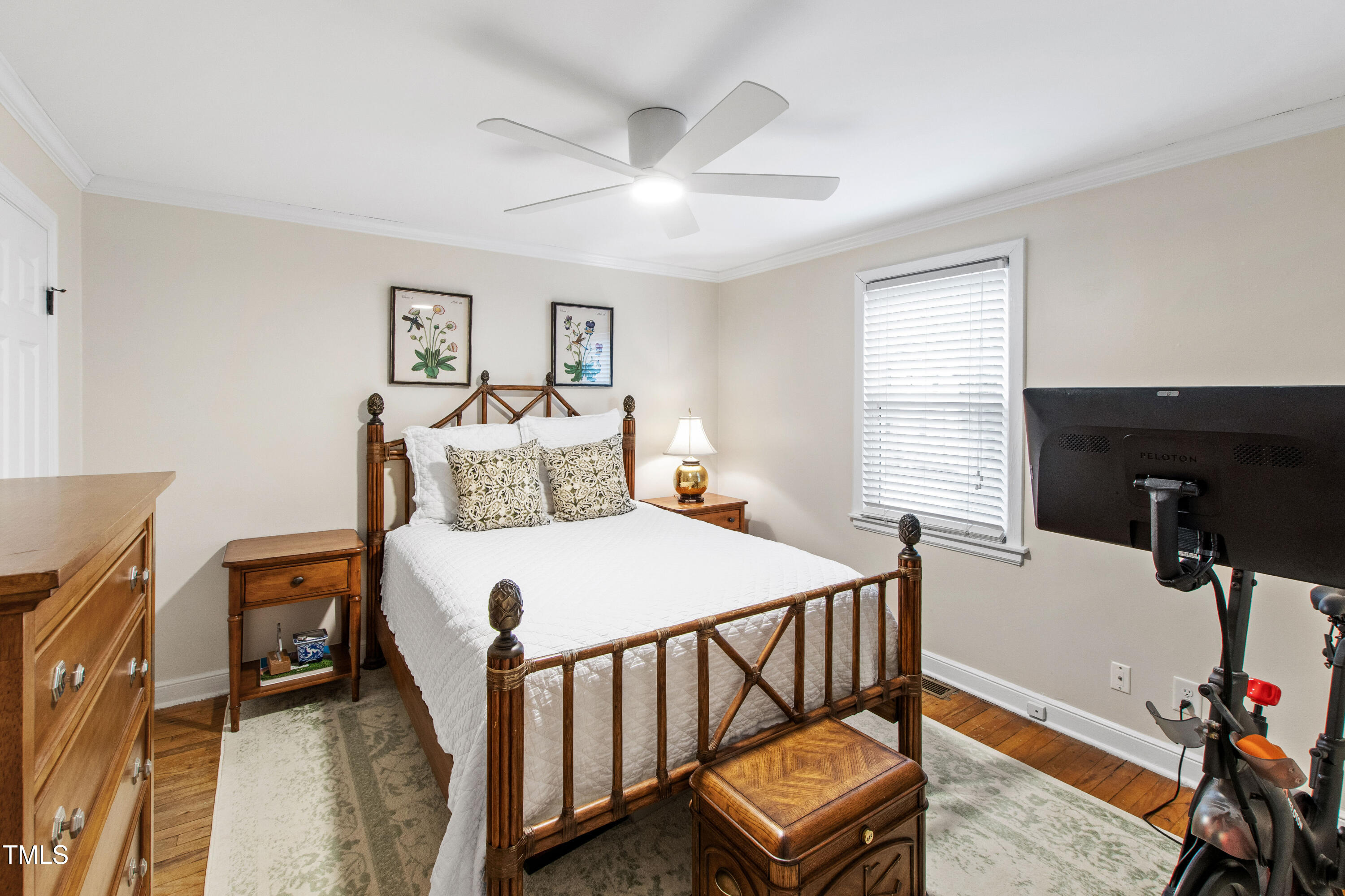 2415 Van Dyke Avenue Raleigh, NC 27607 - Photo 17 of 24 a bedroom with a bed and wooden floor