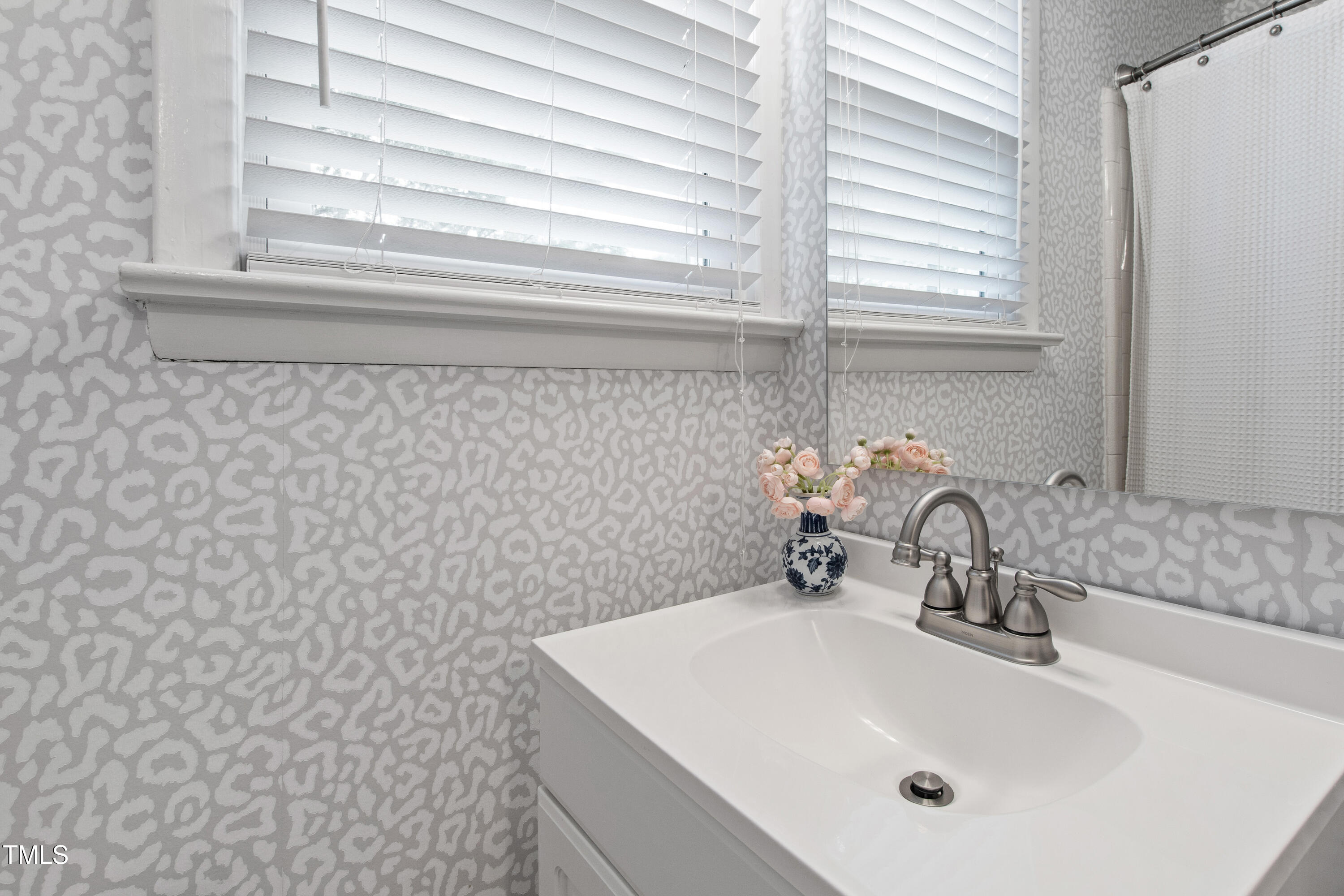 2415 Van Dyke Avenue Raleigh, NC 27607 - Photo 18 of 24 a bathroom with a sink and a window