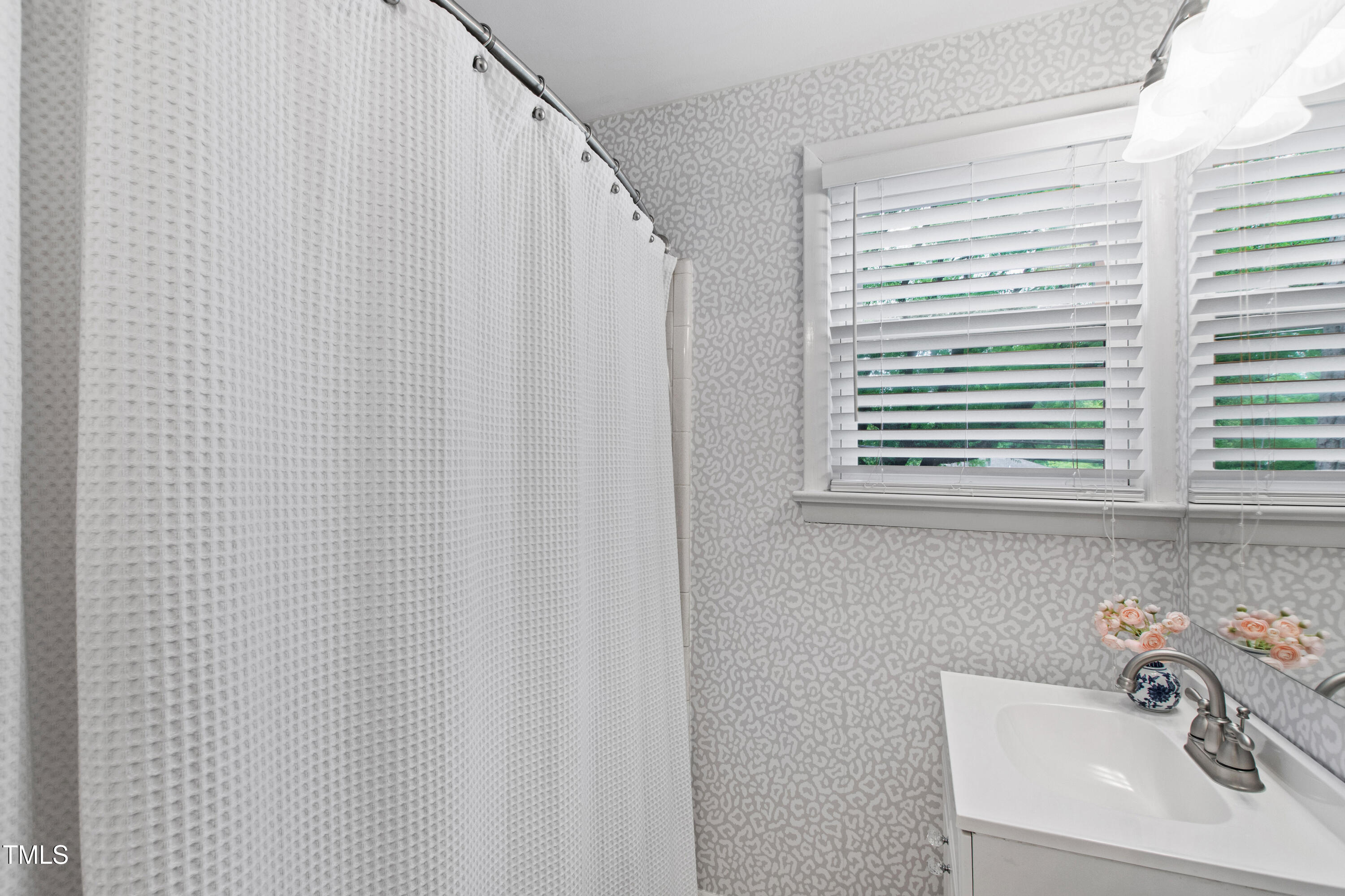 2415 Van Dyke Avenue Raleigh, NC 27607 - Photo 19 of 24 a bathroom with a sink and a window