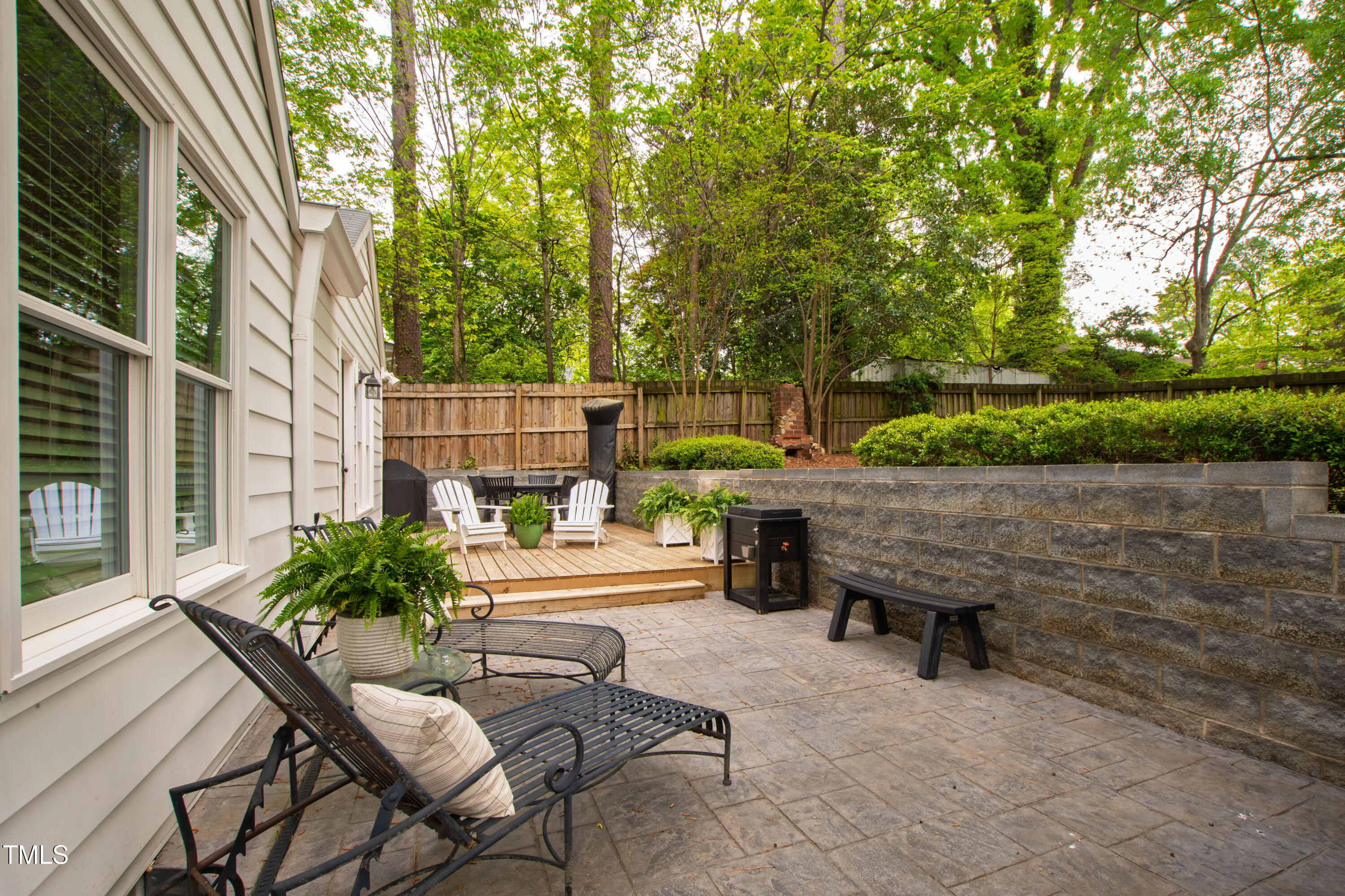 2415 Van Dyke Avenue Raleigh, NC 27607 - Photo 21 of 24 a backyard of a house with fountain table and chairs