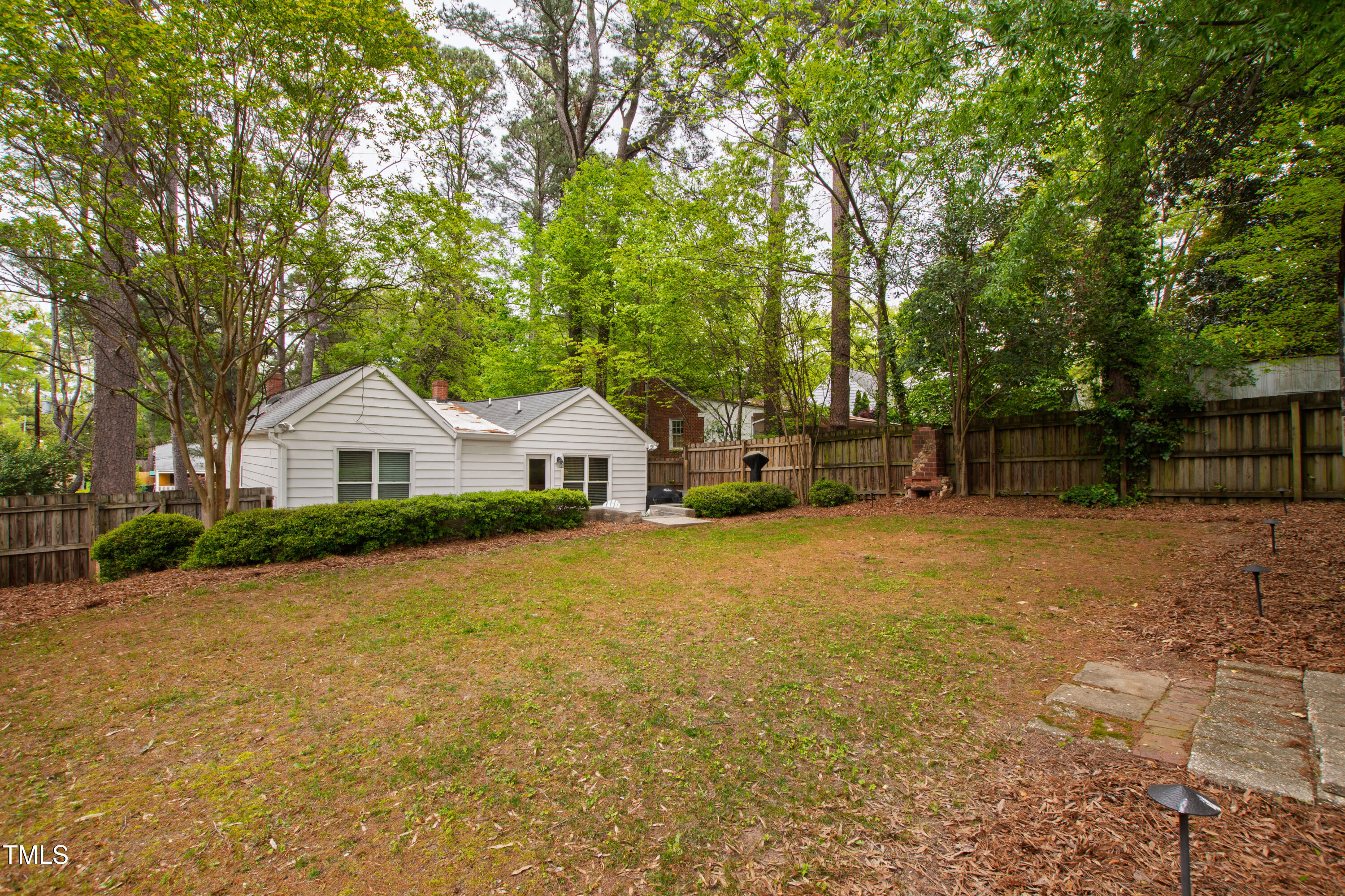 2415 Van Dyke Avenue Raleigh, NC 27607 - Photo 23 of 24 a front view of a house with a yard and garage