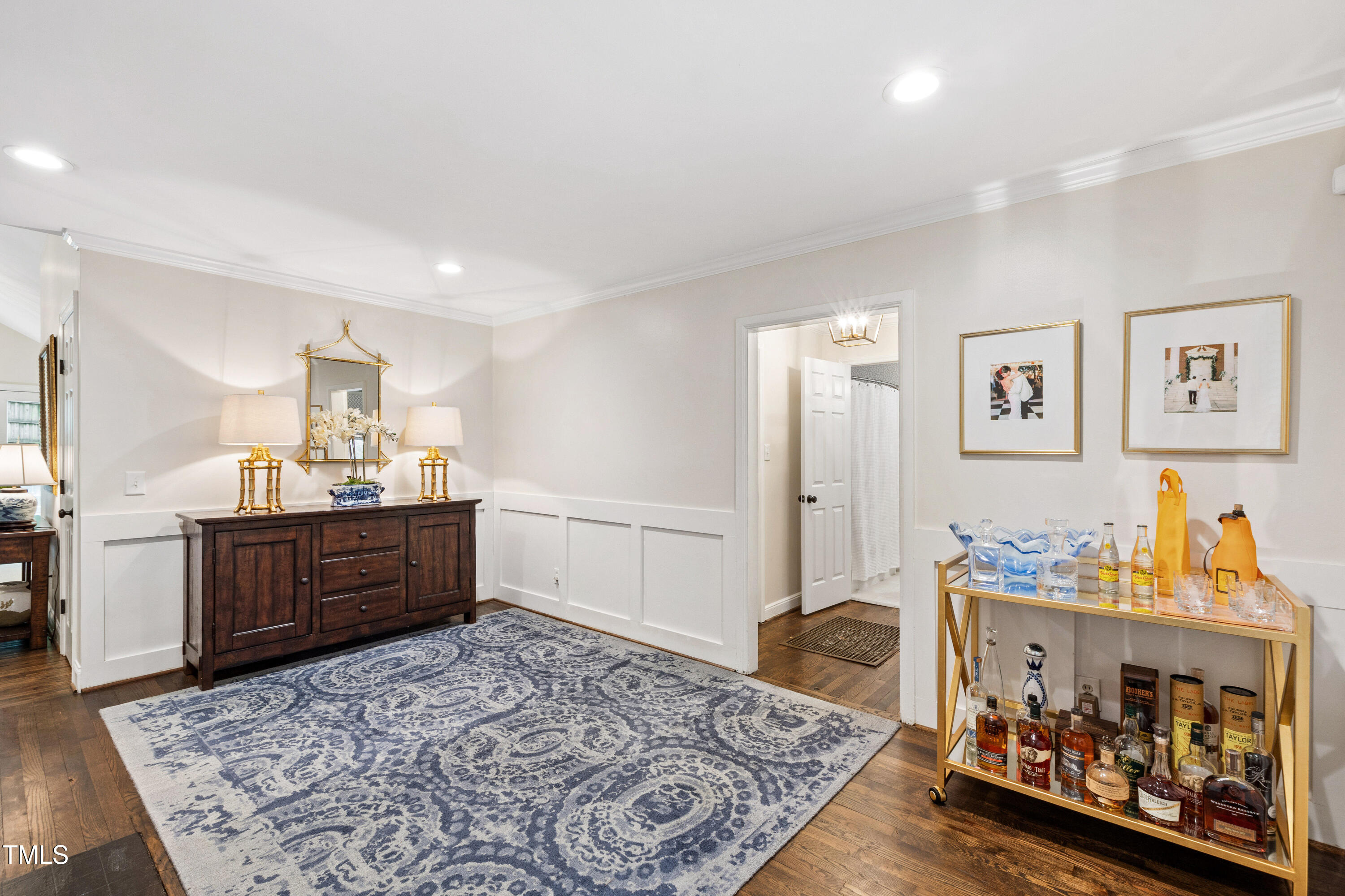 2415 Van Dyke Avenue Raleigh, NC 27607 - Photo 5 of 24 a bed room with a bed and a dresser