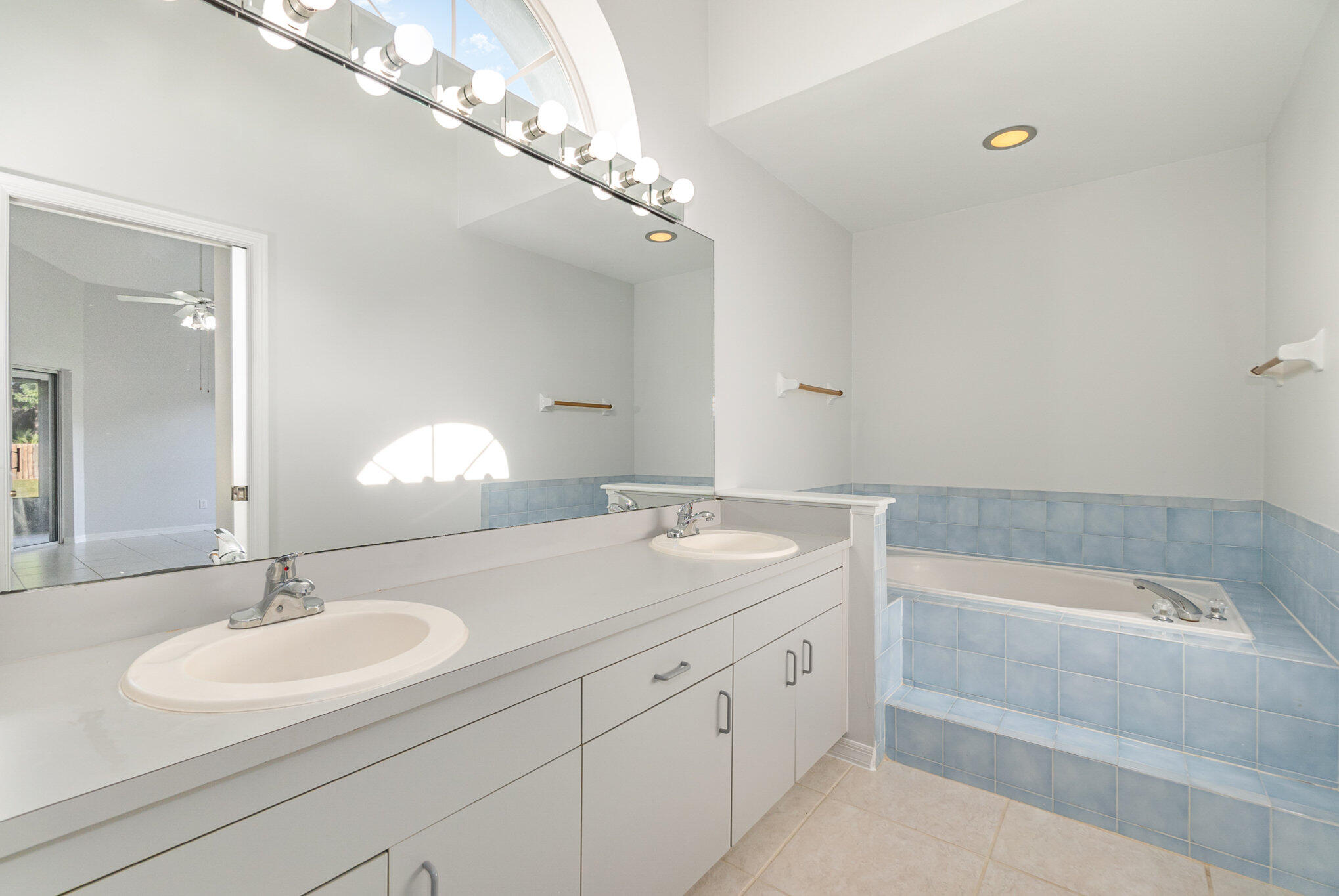 4655 Willow Bend Drive Melbourne, FL 32935 - Photo 15 of 27 a bathroom with a sink double vanity granite tub and a mirror