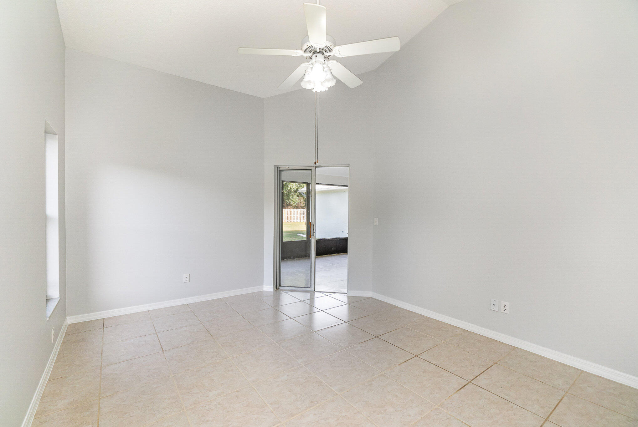 4655 Willow Bend Drive Melbourne, FL 32935 - Photo 16 of 27 an empty room with an entryway and chandelier fan