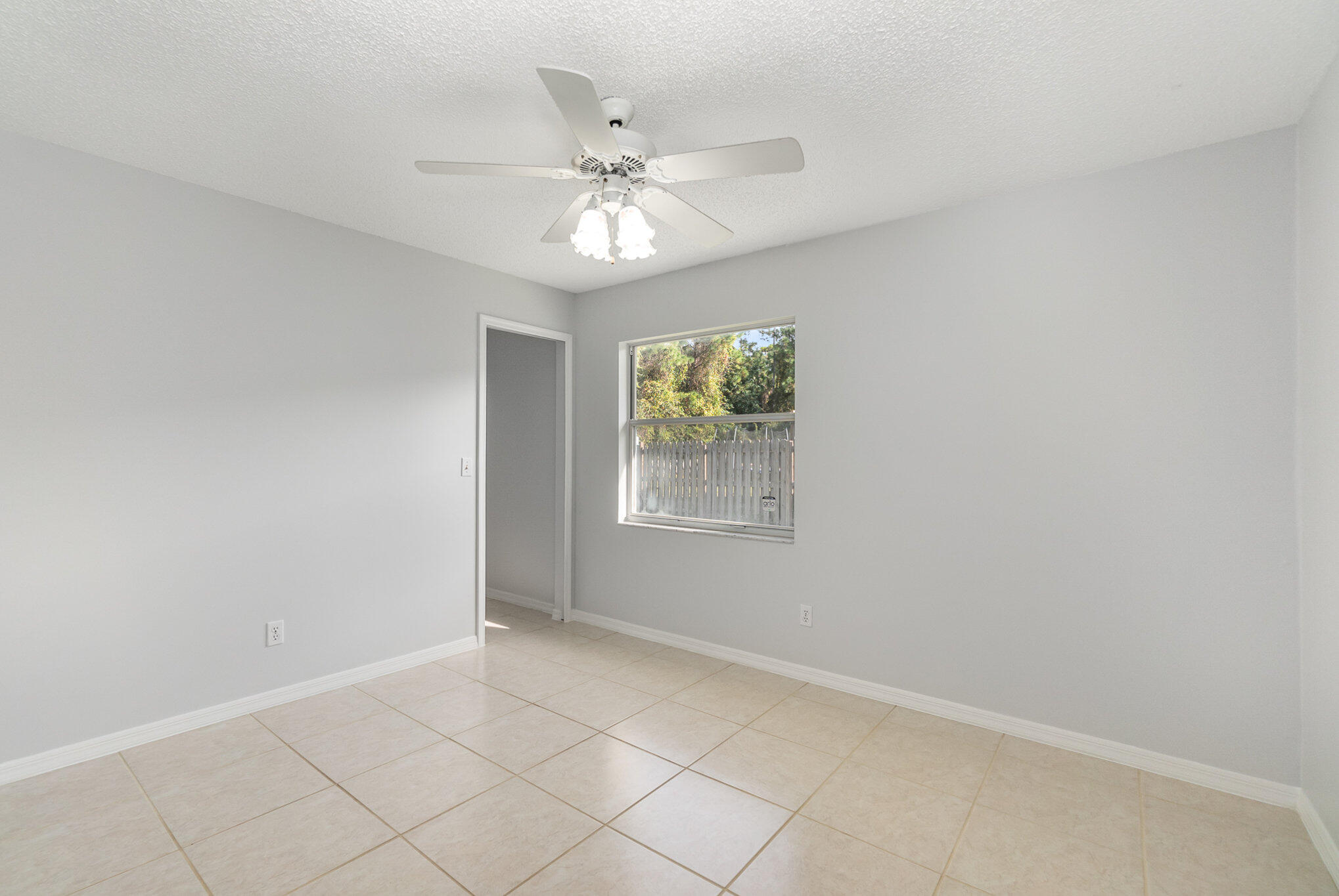4655 Willow Bend Drive Melbourne, FL 32935 - Photo 18 of 27 a view of an empty room with a window