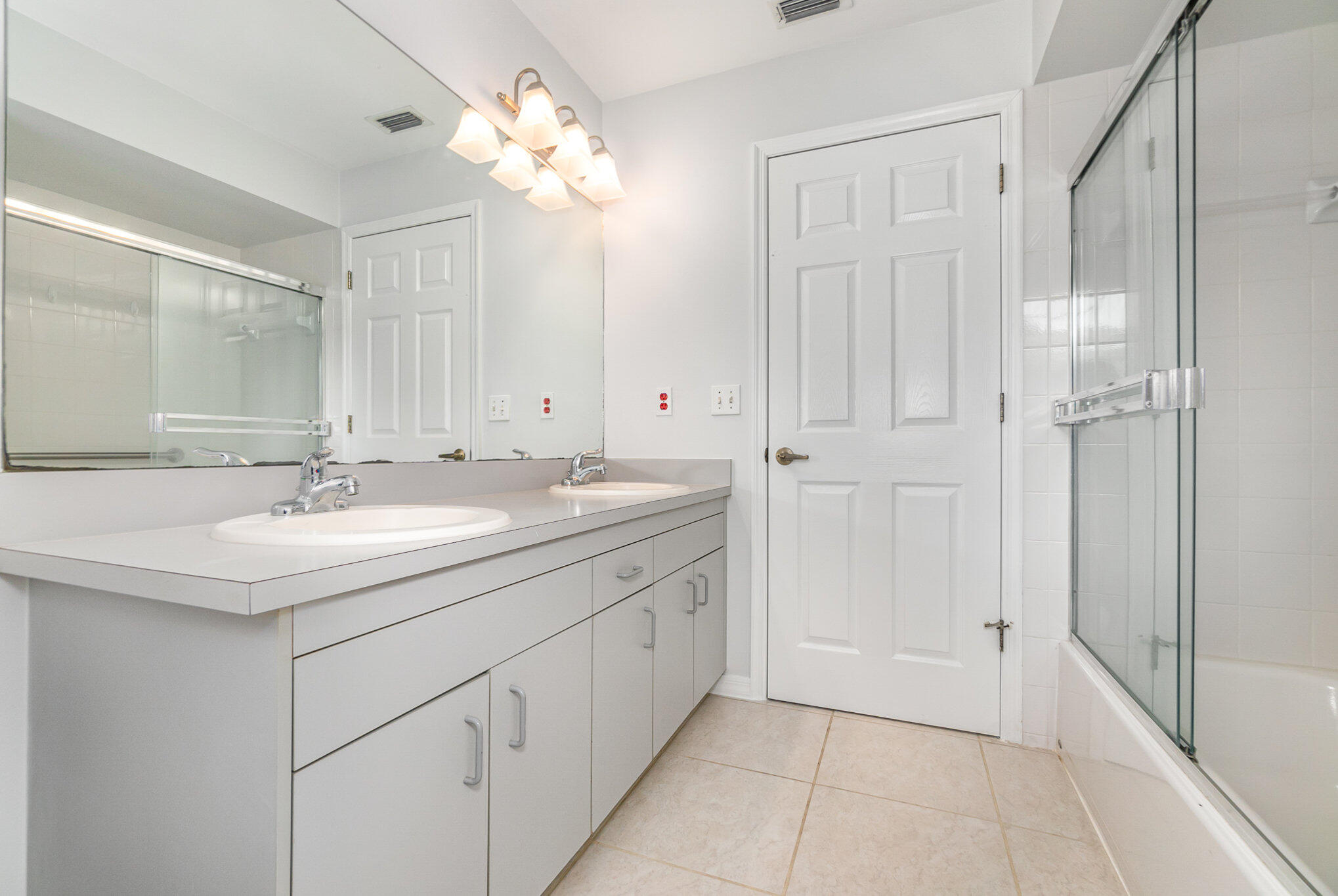 4655 Willow Bend Drive Melbourne, FL 32935 - Photo 19 of 27 a bathroom with a sink double vanity and a mirror