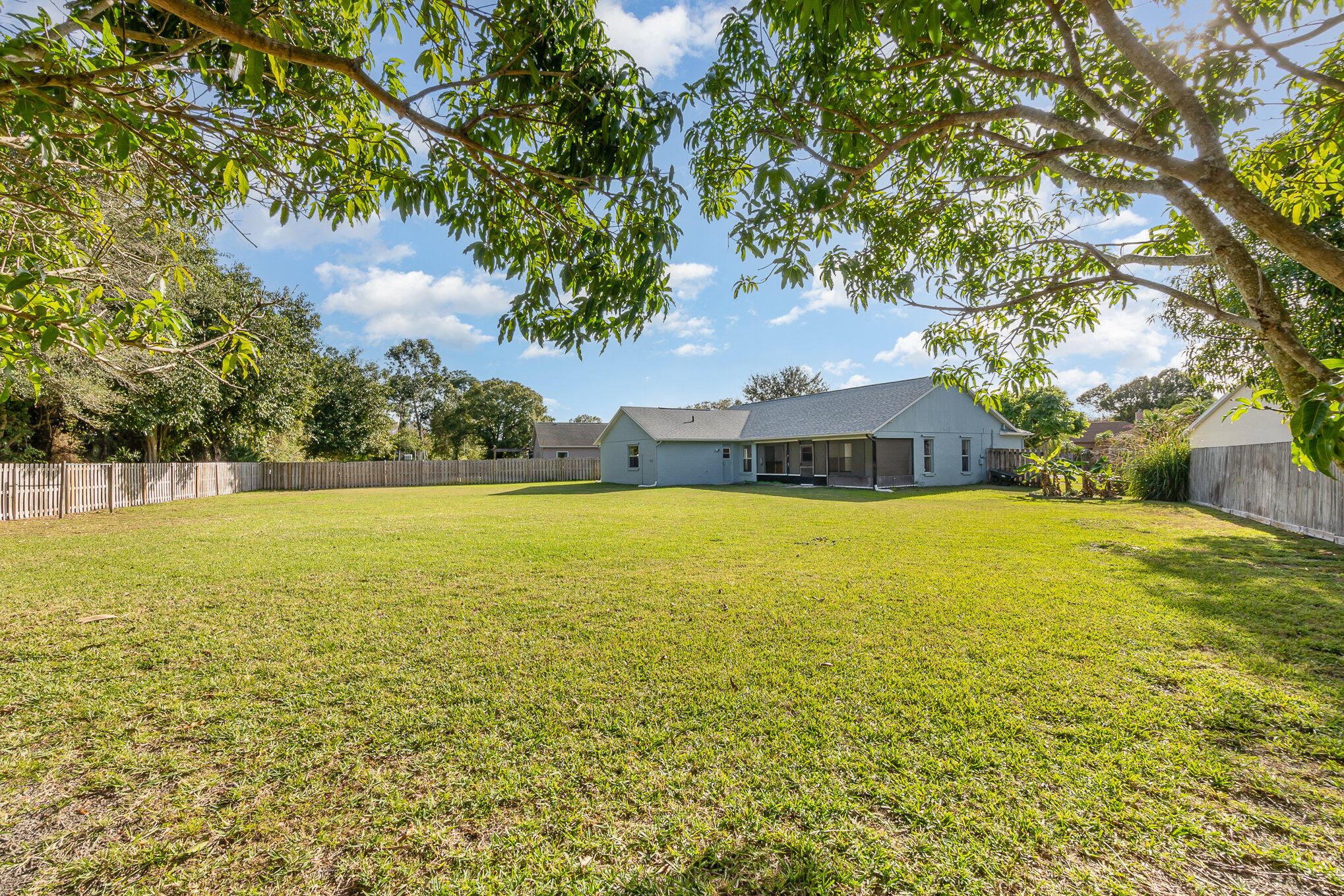 4655 Willow Bend Drive Melbourne, FL 32935 - Photo 2 of 27 a view of a swimming pool with an outdoor space and seating area