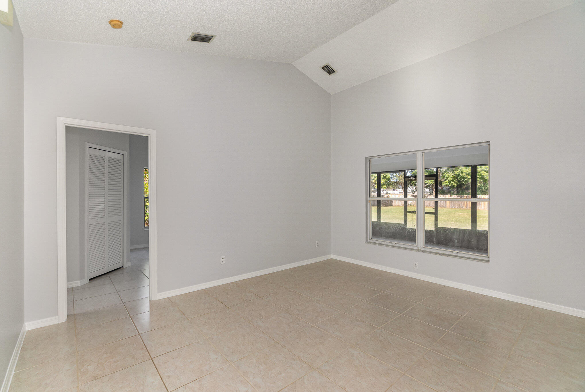 4655 Willow Bend Drive Melbourne, FL 32935 - Photo 23 of 27 an empty room with windows and closet