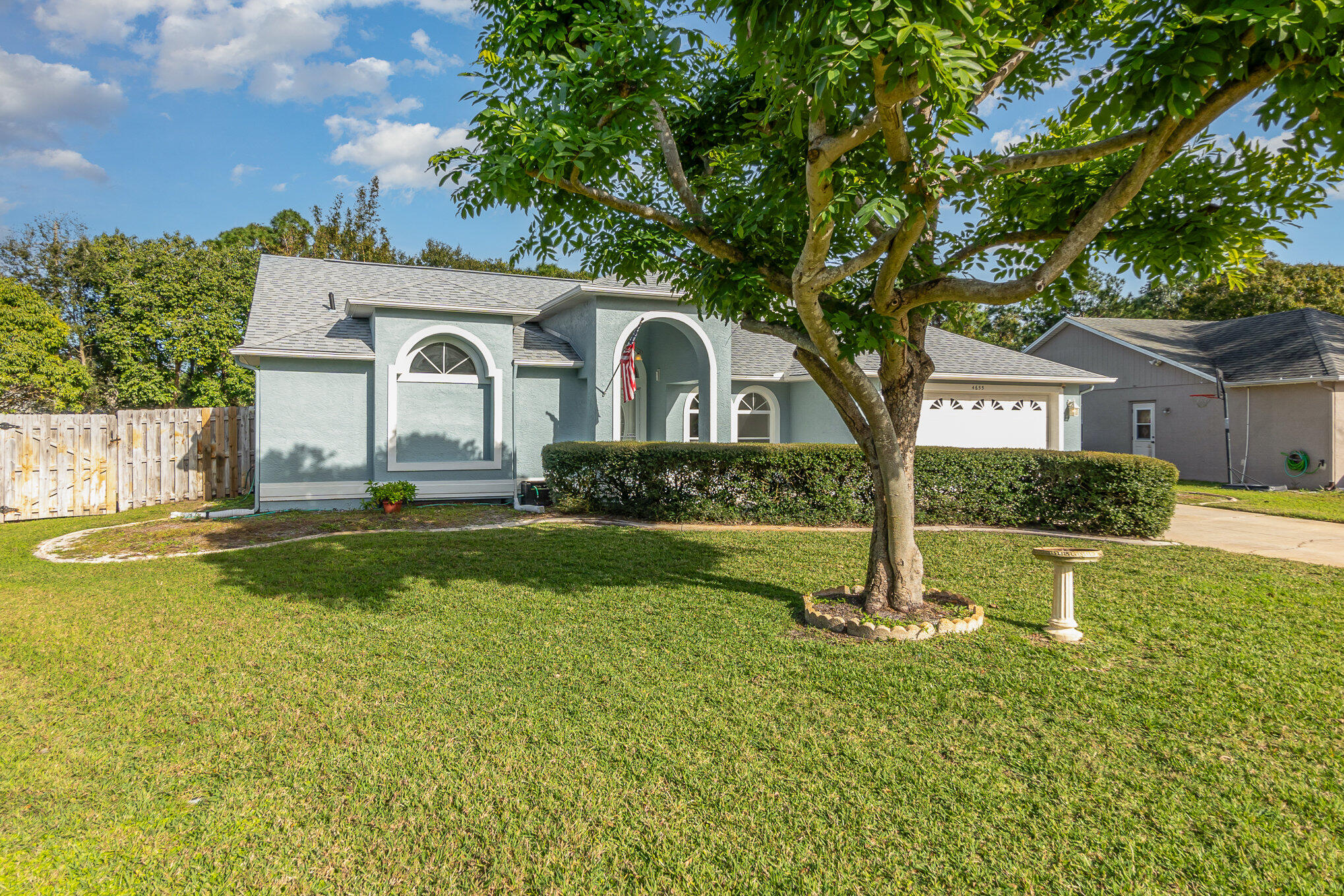 4655 Willow Bend Drive Melbourne, FL 32935 - Photo 3 of 27 a front view of a house with yard and green space