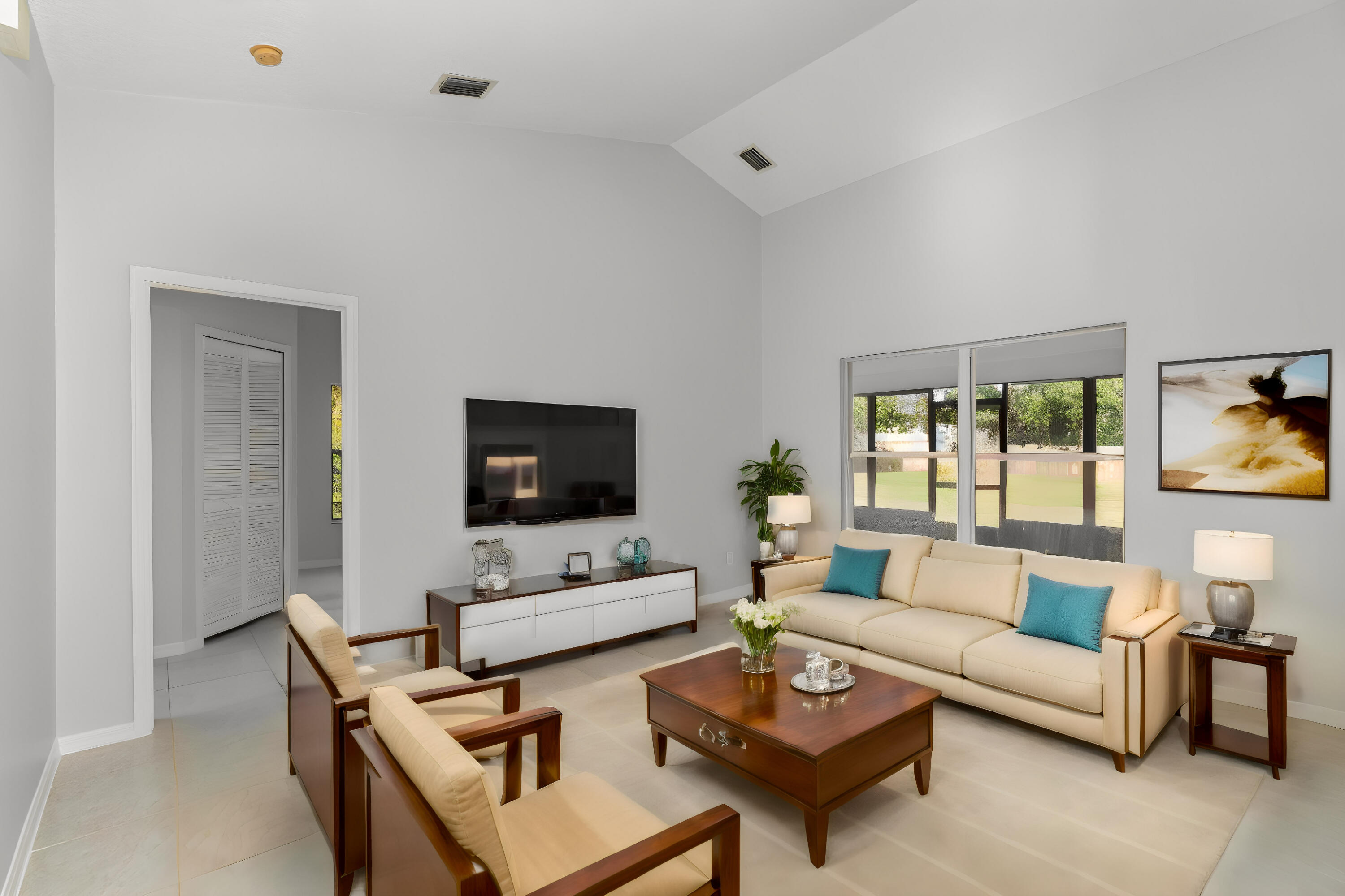 4655 Willow Bend Drive Melbourne, FL 32935 - Photo 4 of 27 a living room with furniture a flat screen tv and a window