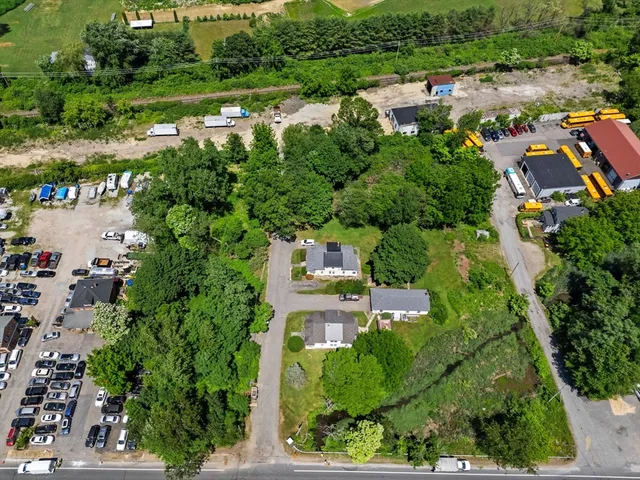 an aerial view of house with yard swimming pool and outdoor seating