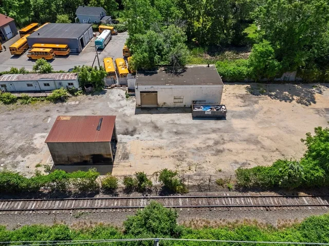 a aerial view of a house with a yard