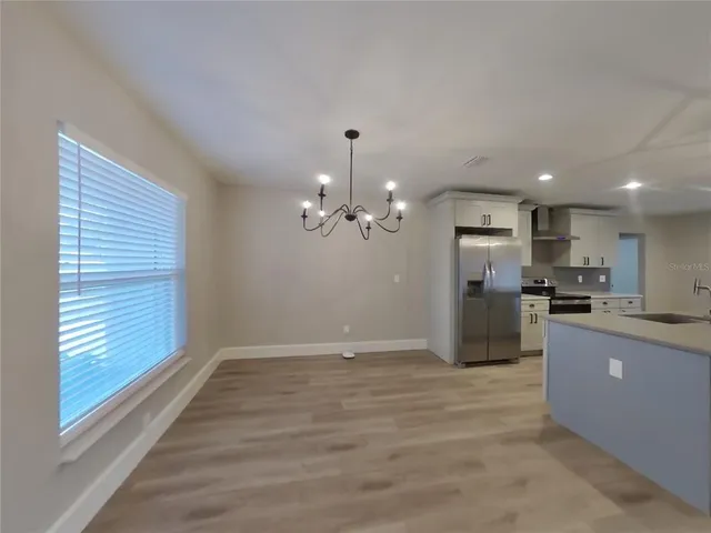 a view of a kitchen with a sink