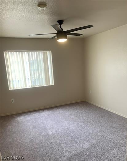 3318 North Decatur Boulevard, Unit 2093 Las Vegas, NV 89130 - Photo 3 of 10 Well-lit room with ample space, featuring a modern ceiling fan and plush carpeting.