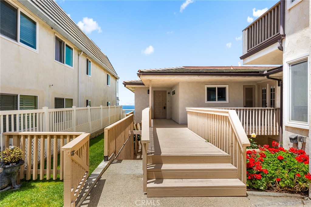 34381 Dana Strand Road, Unit 2 Dana Point, CA 92629 - Photo 30 of 32 a view of a house with wooden floor and a fence