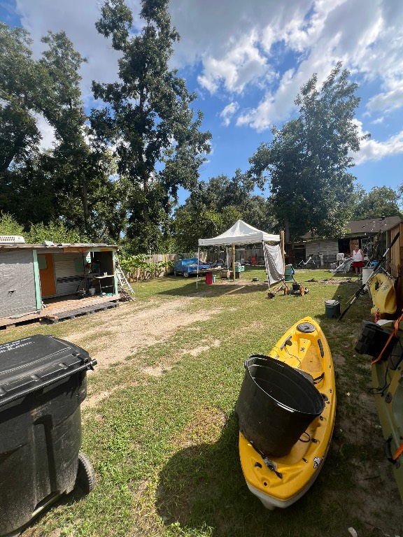 a view of a swimming pool with a yard