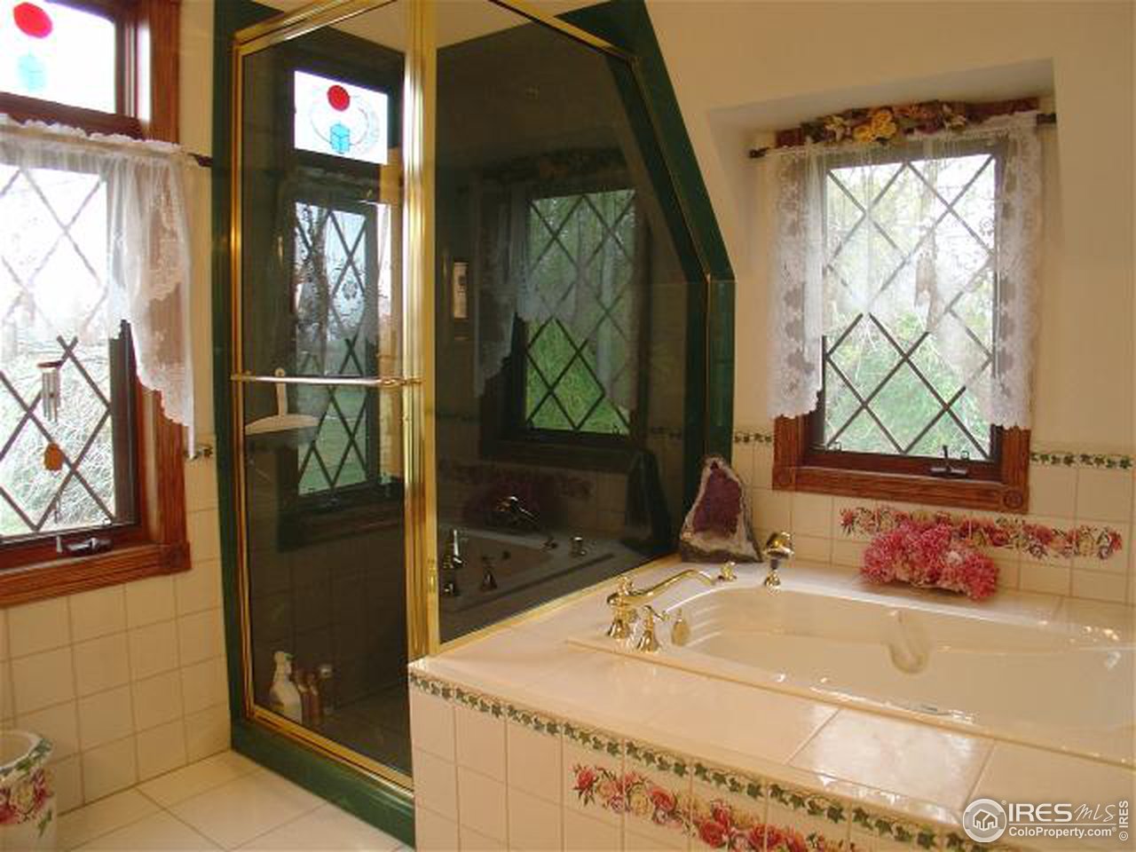 5575 St Vrain Road Longmont, CO 80503 - Photo 7 of 10 a bathroom with a sink and a mirror