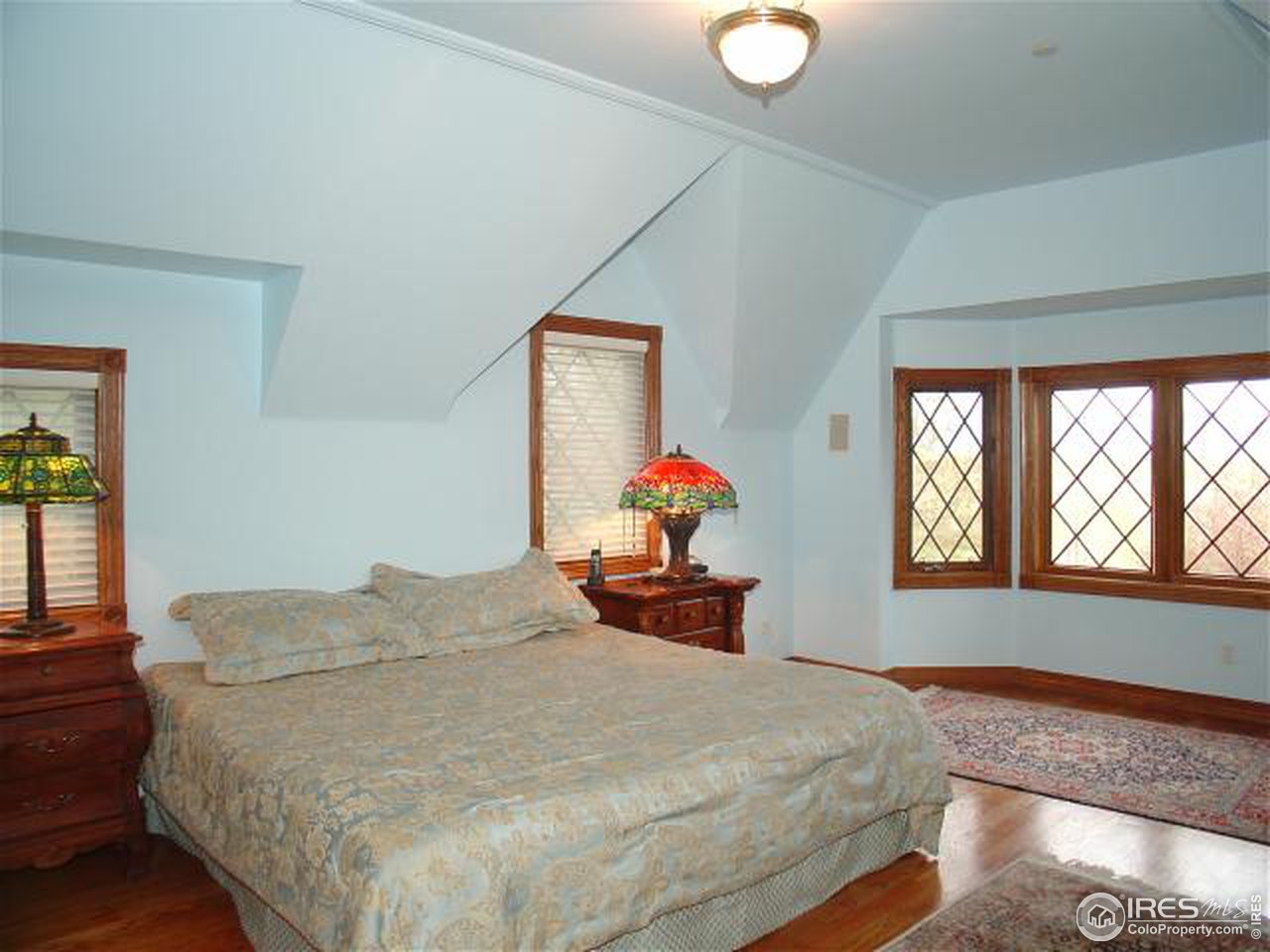 5575 St Vrain Road Longmont, CO 80503 - Photo 9 of 10 a bedroom with a bed and window