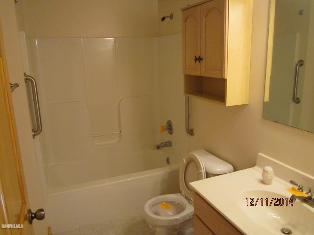 6 Snipe Hollow Road Elizabeth, IL 61028 - Photo 11 of 23 a bathroom with a sink a toilet and shower