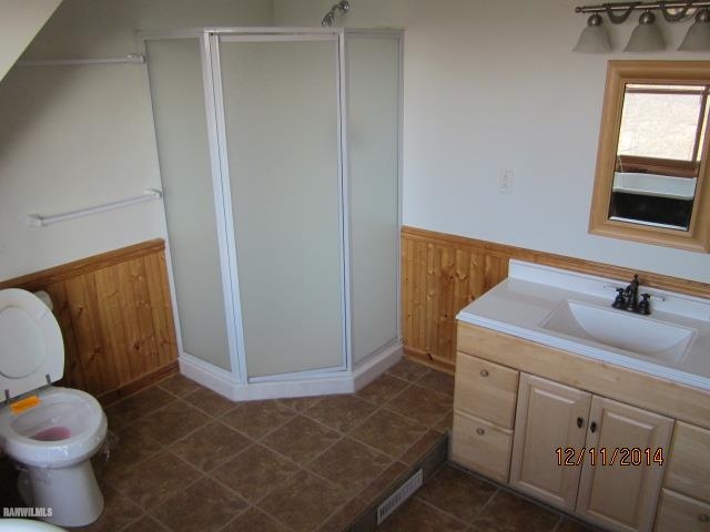 6 Snipe Hollow Road Elizabeth, IL 61028 - Photo 17 of 23 a bathroom with a toilet sink and mirror