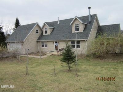 6 Snipe Hollow Road Elizabeth, IL 61028 - Photo 2 of 23 a front view of a house with a yard