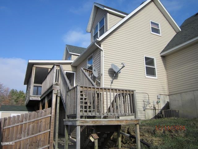 6 Snipe Hollow Road Elizabeth, IL 61028 - Photo 22 of 23 a view of a house with wooden deck