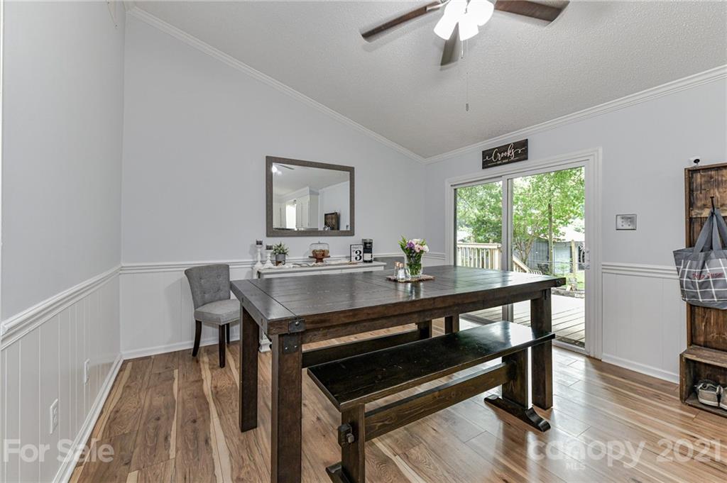 1706 Carson Street Monroe, NC 28110 - Photo 15 of 36 a view of a dining room with furniture window and wooden floor