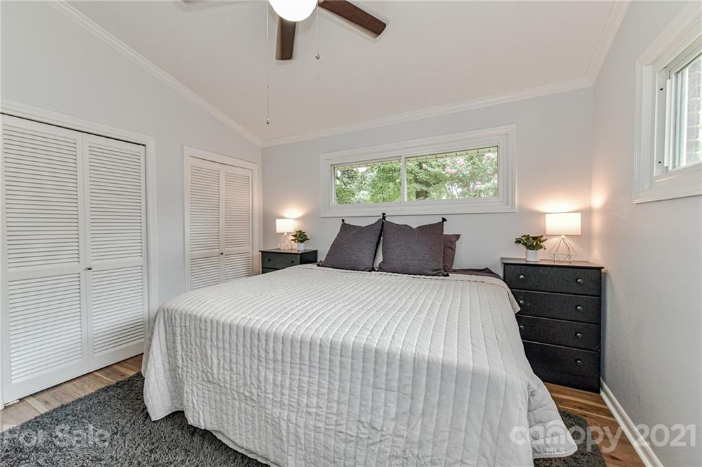 1706 Carson Street Monroe, NC 28110 - Photo 17 of 36 a bedroom with a bed and a window