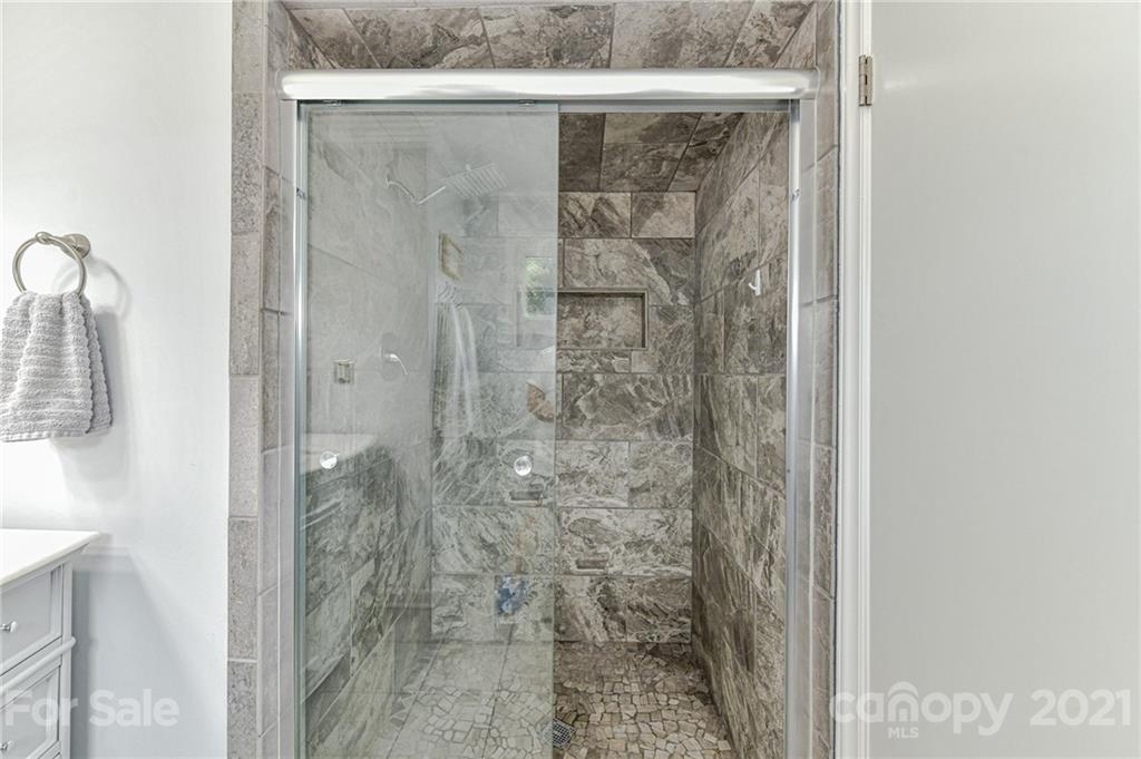 1706 Carson Street Monroe, NC 28110 - Photo 19 of 36 a bathroom with a shower