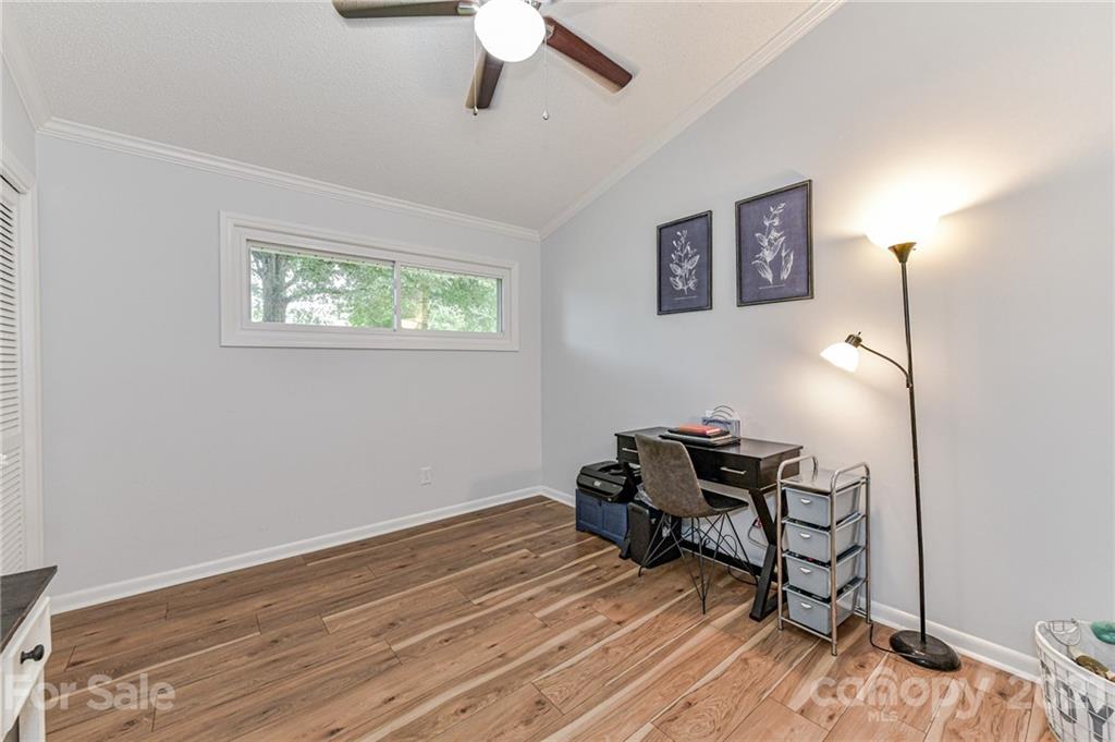 1706 Carson Street Monroe, NC 28110 - Photo 23 of 36 a room with furniture and wooden floor