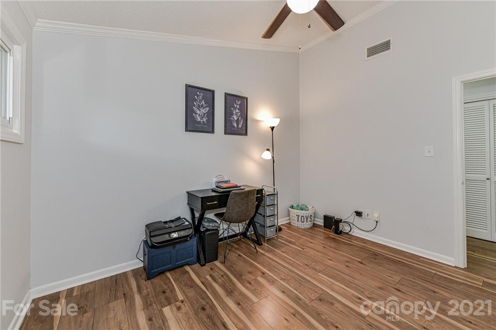 1706 Carson Street Monroe, NC 28110 - Photo 24 of 36 a room with furniture and a ceiling fan