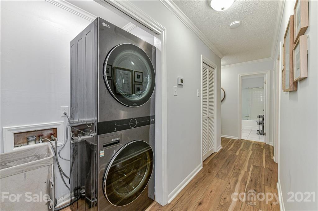 1706 Carson Street Monroe, NC 28110 - Photo 26 of 36 a view of a hallway with washer and dryer