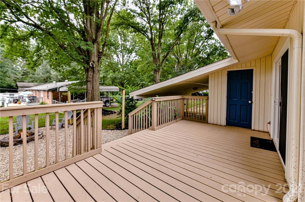 1706 Carson Street Monroe, NC 28110 - Photo 29 of 36 a balcony with wooden floor and fence