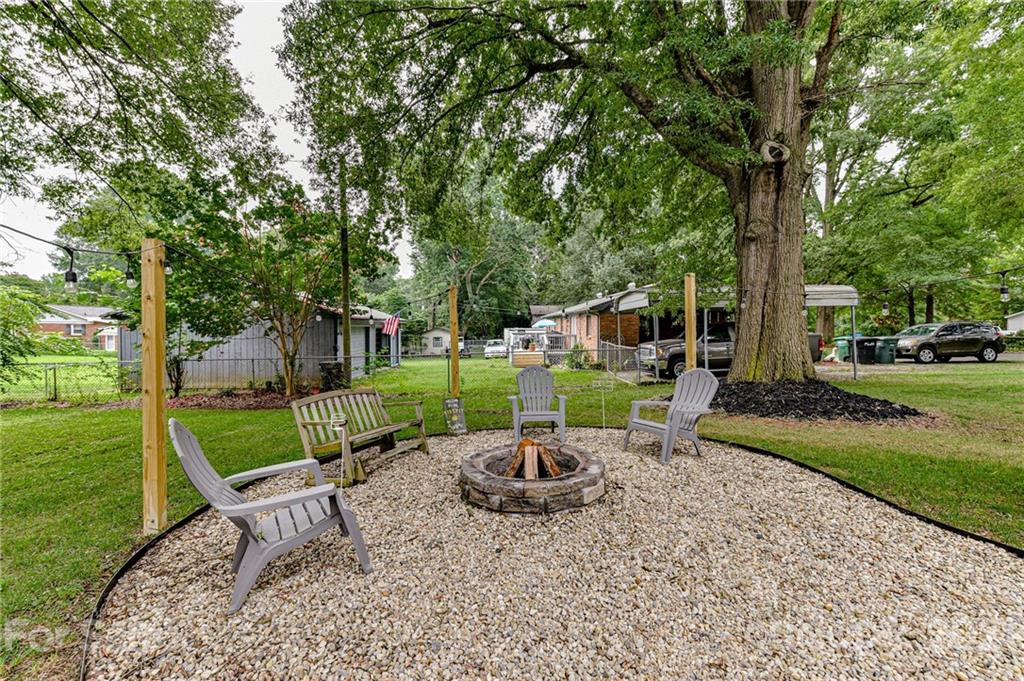 1706 Carson Street Monroe, NC 28110 - Photo 31 of 36 a view of a garden with a patio