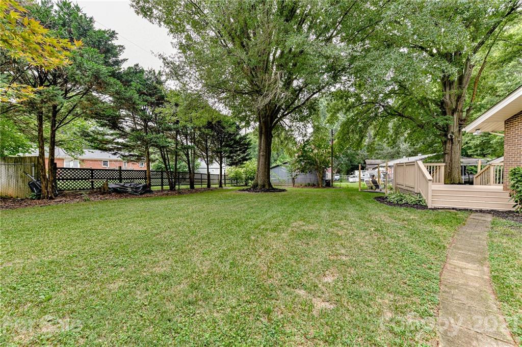 1706 Carson Street Monroe, NC 28110 - Photo 32 of 36 a view of a house with backyard and sitting area