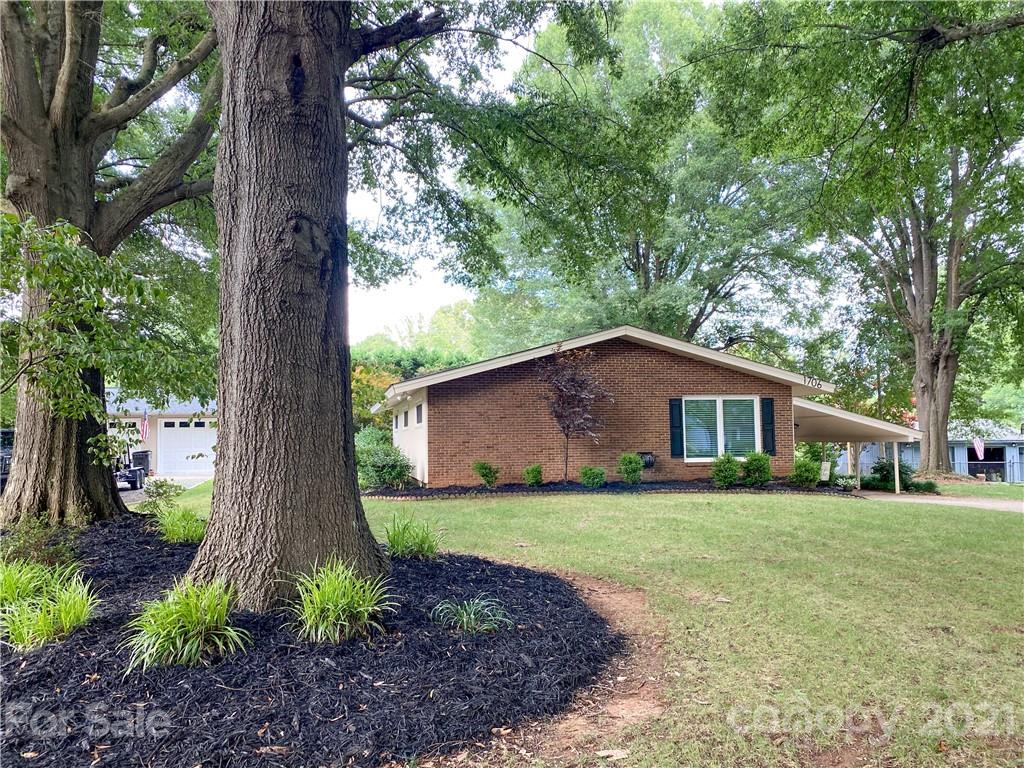 1706 Carson Street Monroe, NC 28110 - Photo 36 of 36 a front view of house with a garden