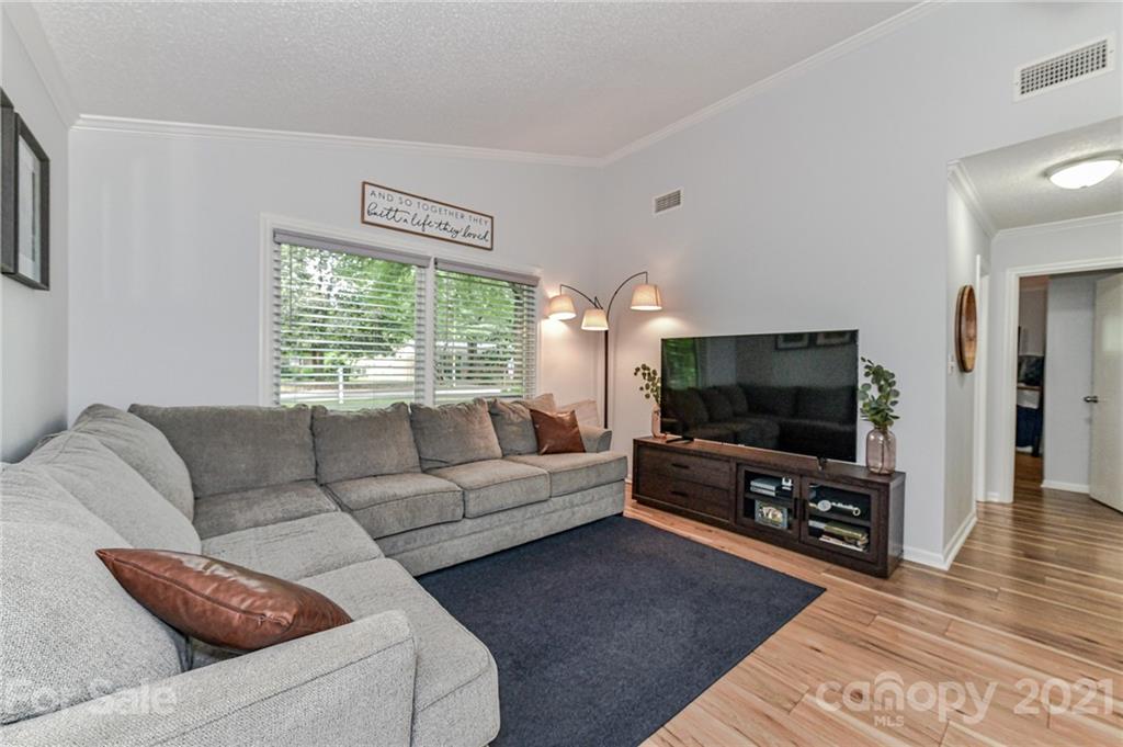 1706 Carson Street Monroe, NC 28110 - Photo 5 of 36 a living room with furniture and a flat screen tv
