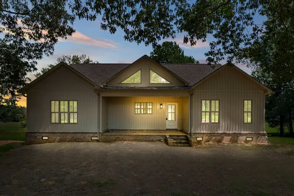 a front view of a house with yard