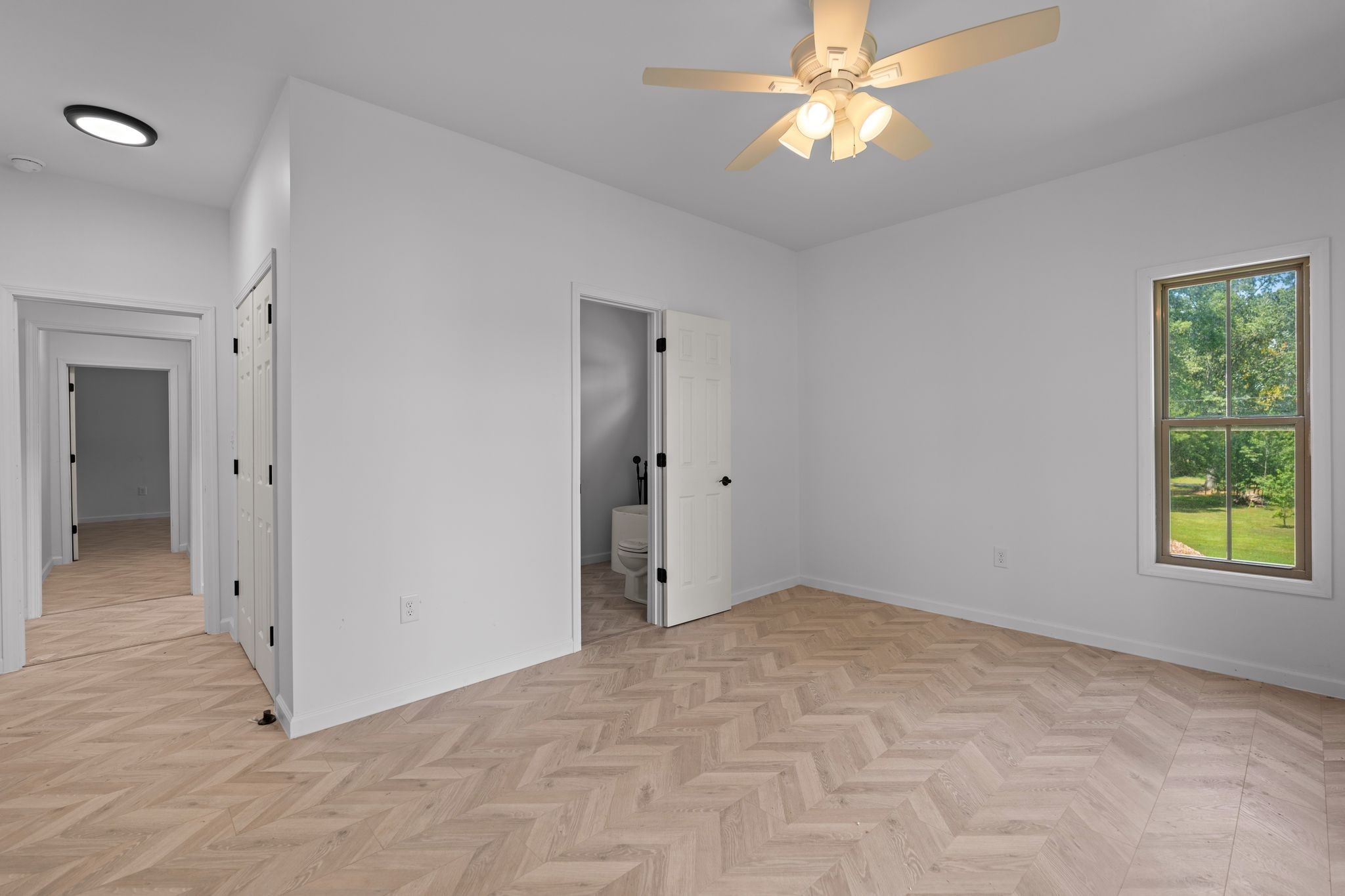 324 Fisherdale Drive Decaturville, TN 38329 - Photo 12 of 36 an empty room with closet and a chandelier fan