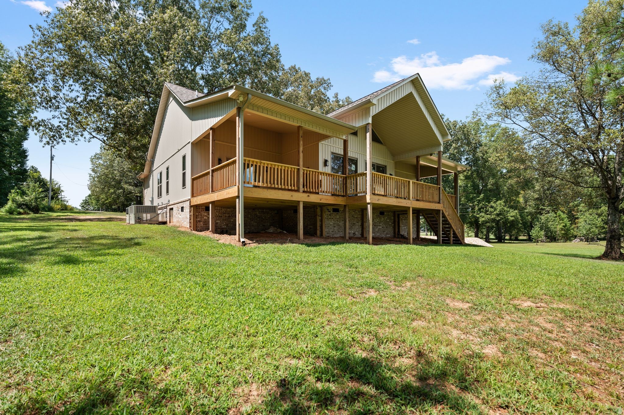 324 Fisherdale Drive Decaturville, TN 38329 - Photo 19 of 36 a view of a house with a big yard and large trees