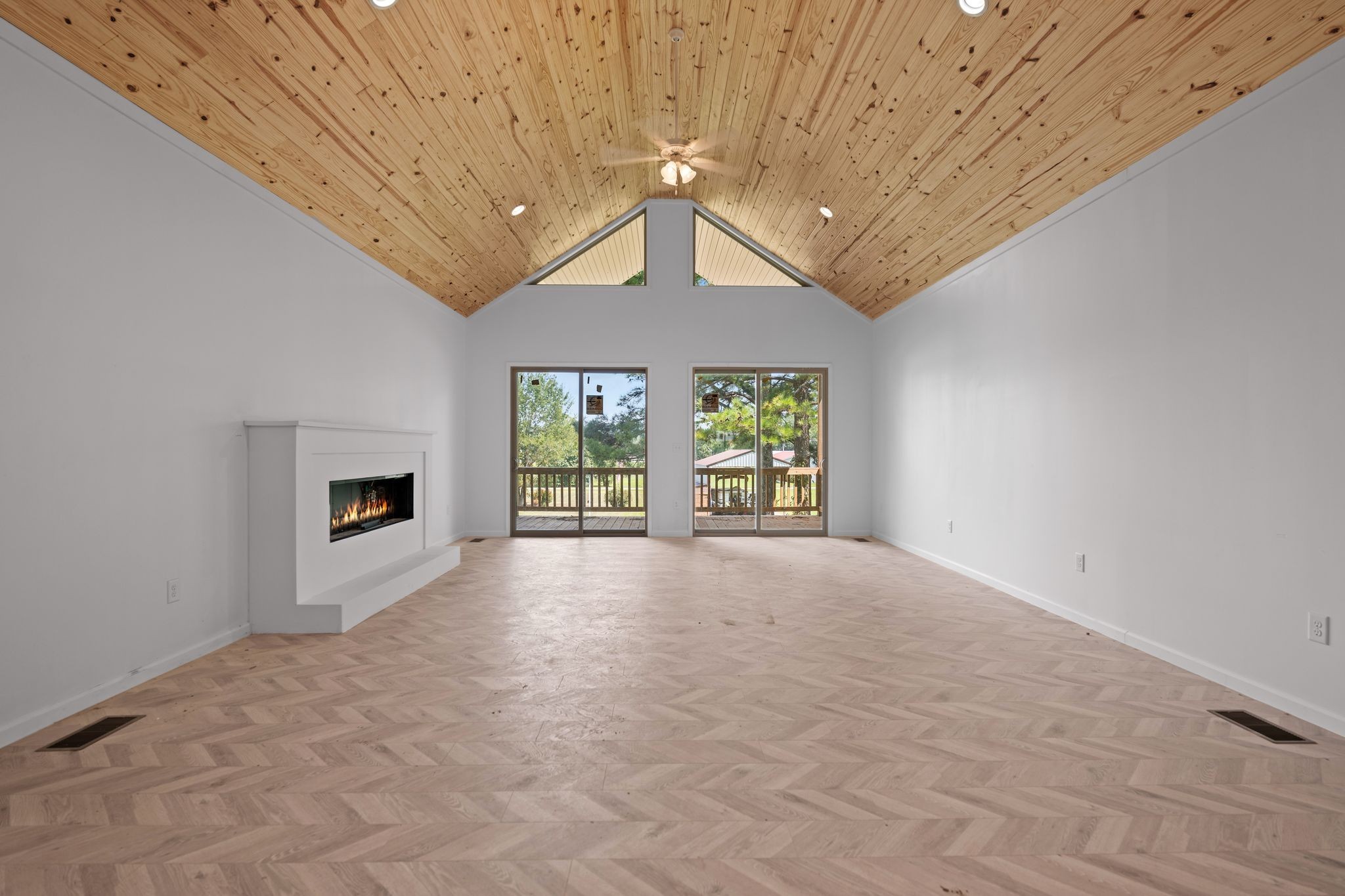 324 Fisherdale Drive Decaturville, TN 38329 - Photo 25 of 36 a view of an empty room with a fireplace and a window