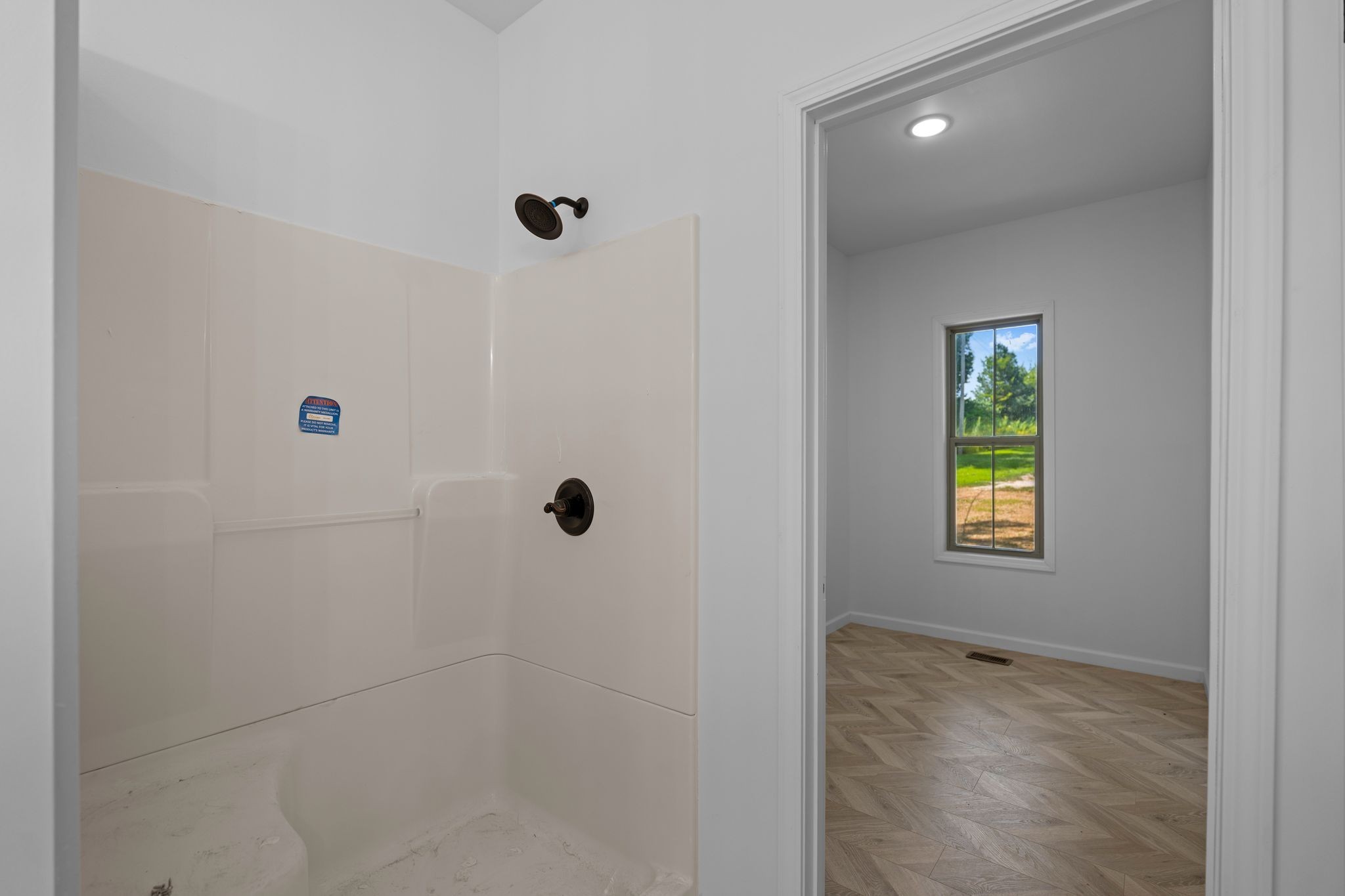 324 Fisherdale Drive Decaturville, TN 38329 - Photo 34 of 36 a bathroom with a window and shower