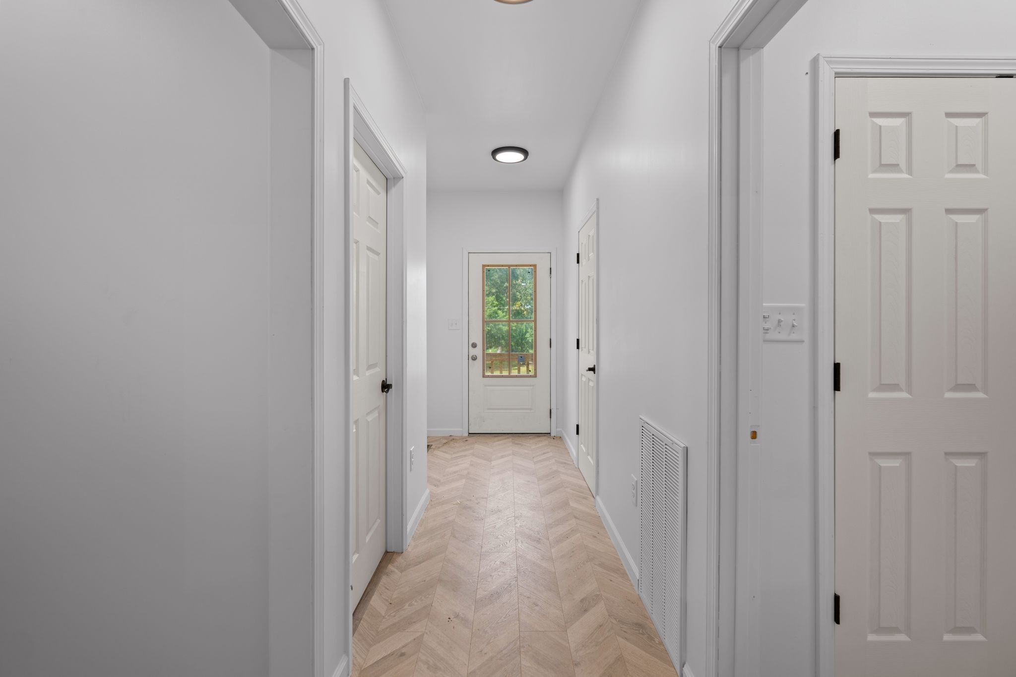 324 Fisherdale Drive Decaturville, TN 38329 - Photo 35 of 36 a view of a hallway with wooden floor