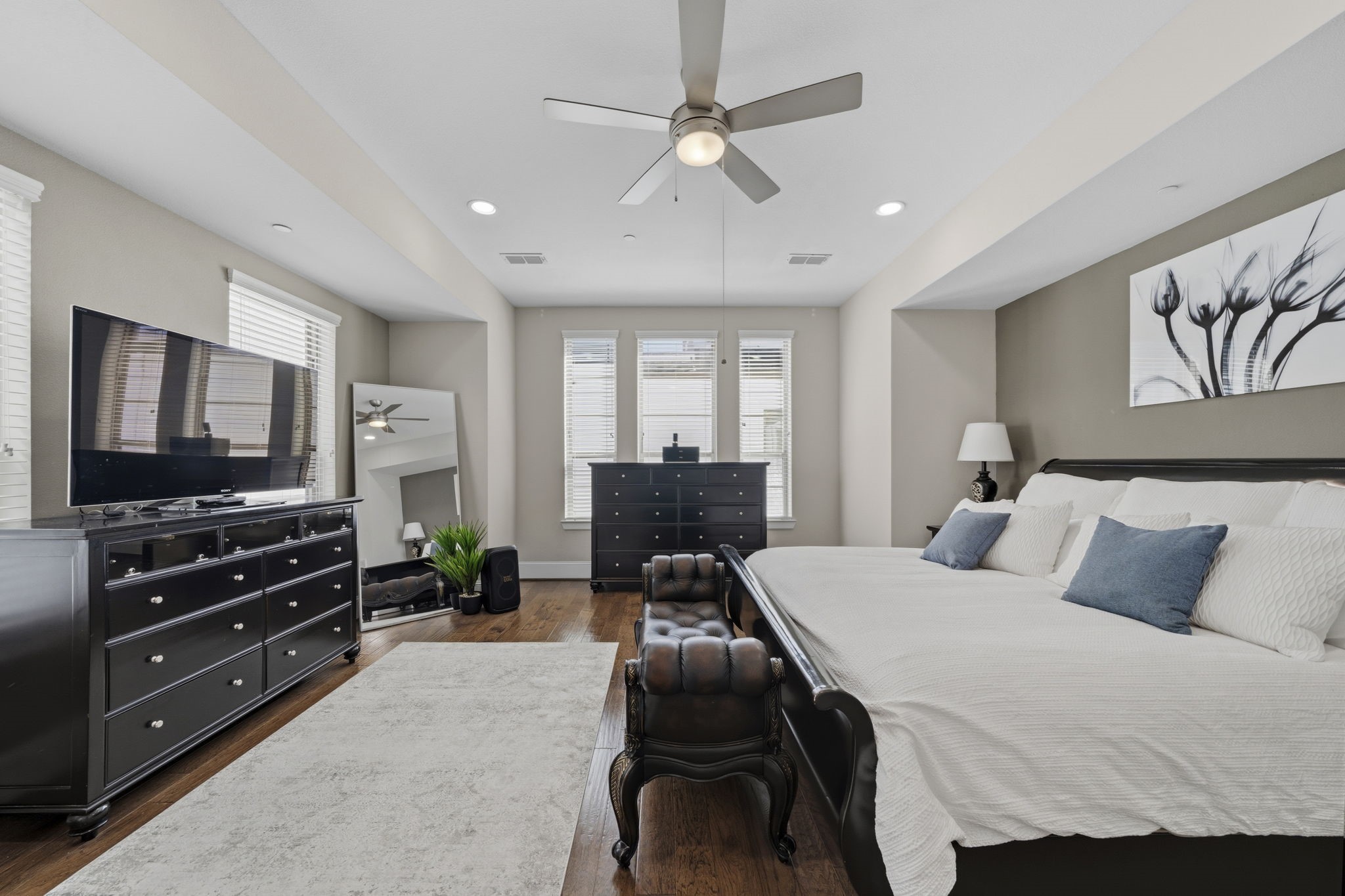 5467 Larkin Street Houston, TX 77007 - Photo 16 of 33 a bedroom with a bed and a flat screen tv