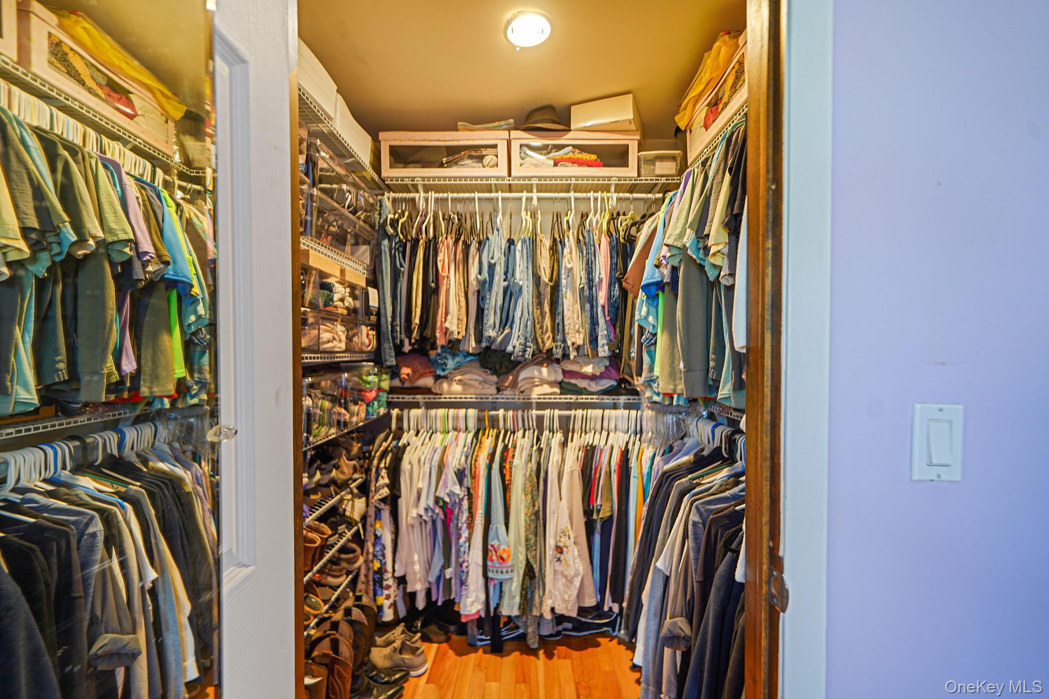 12 Harbor Beach Road Miller Place, NY 11764 - Photo 24 of 45 Walk in closet featuring light wood-style floors