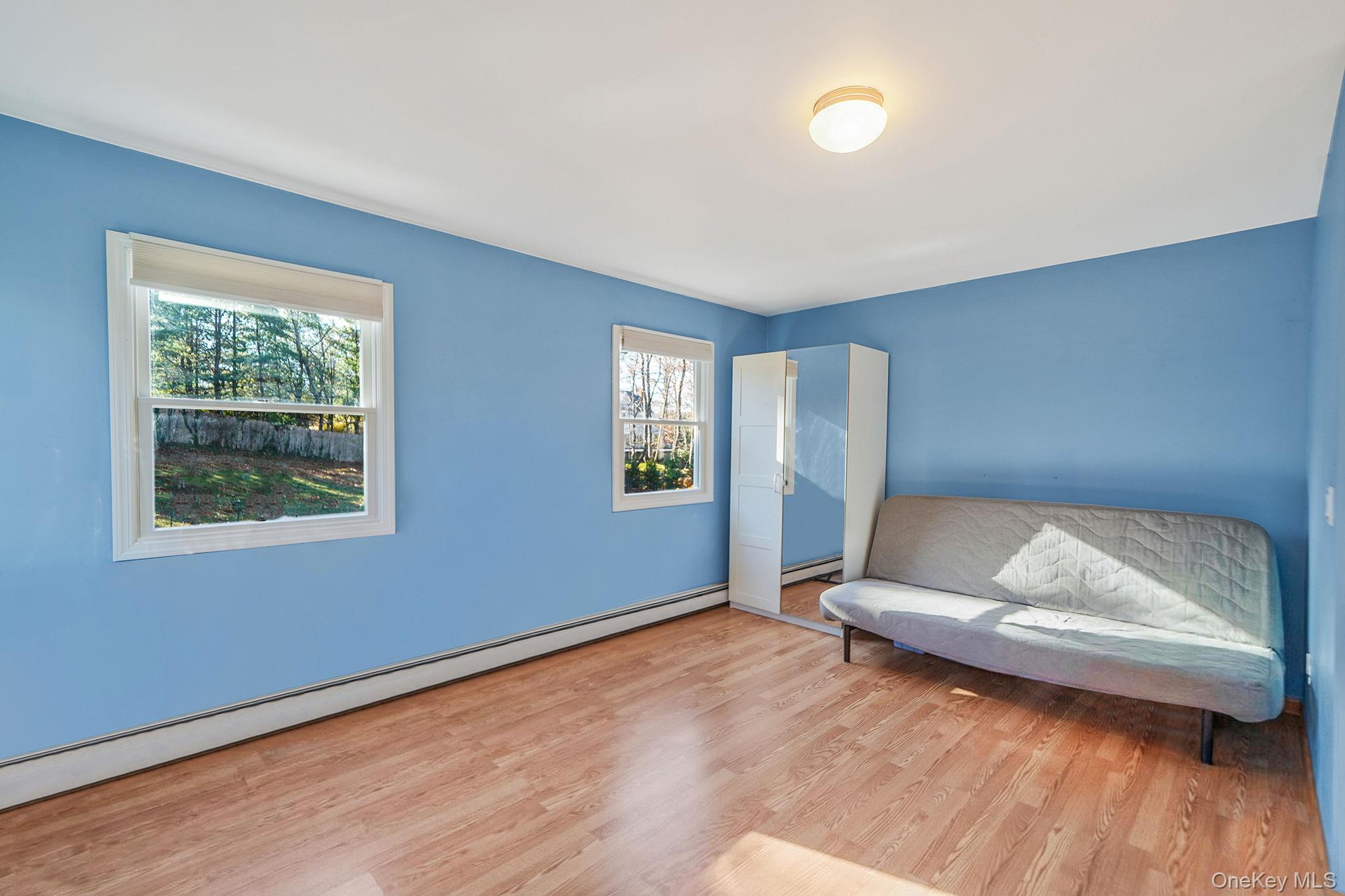 12 Harbor Beach Road Miller Place, NY 11764 - Photo 26 of 45 Sitting room with baseboard heating and wood finished floors